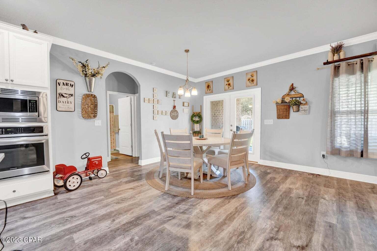 622 Cornelia Street Freeport, FL 32439 - Photo 26 of 43 a view of a dining room with furniture and chandelier