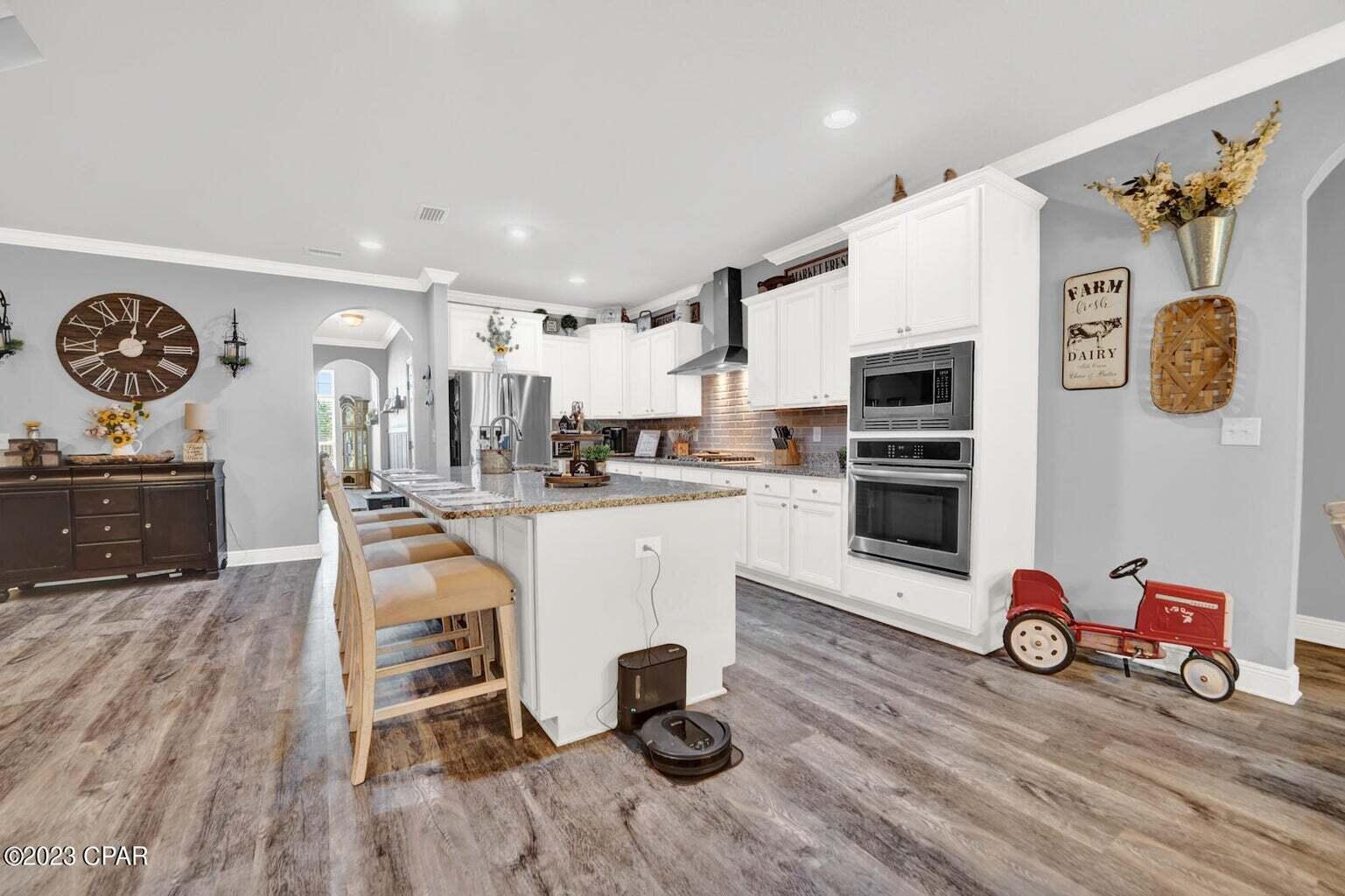 622 Cornelia Street Freeport, FL 32439 - Photo 29 of 43 a living room with furniture and a table