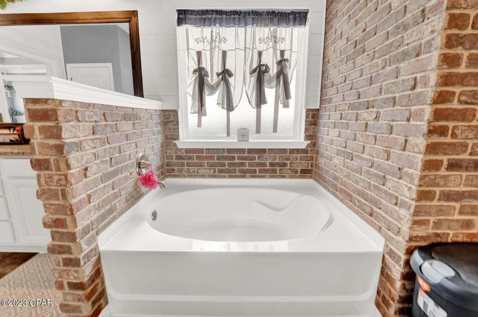 622 Cornelia Street Freeport, FL 32439 - Photo 30 of 43 a bathroom with a bathtub and shower