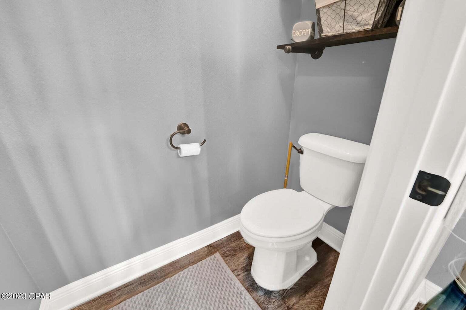 622 Cornelia Street Freeport, FL 32439 - Photo 32 of 43 a white toilet sitting next to a shower