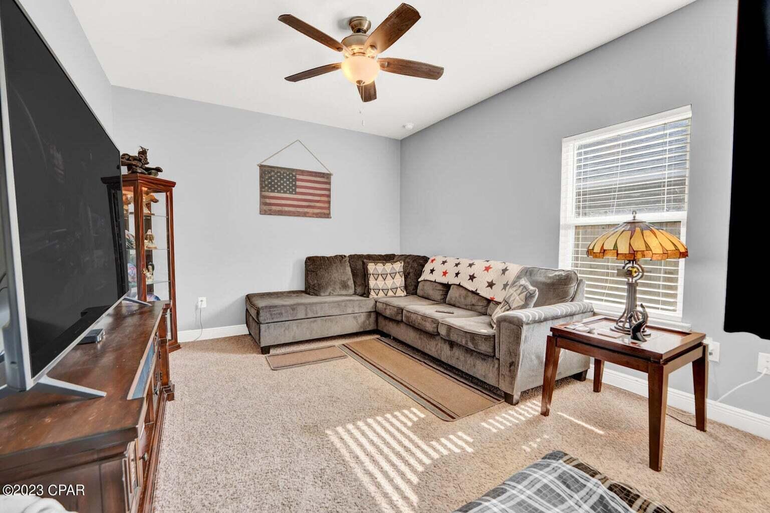 622 Cornelia Street Freeport, FL 32439 - Photo 38 of 43 a living room with furniture and a flat screen tv