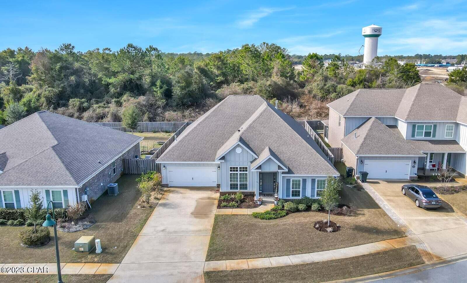 622 Cornelia Street Freeport, FL 32439 - Photo 41 of 43 a front view of a house with a garden