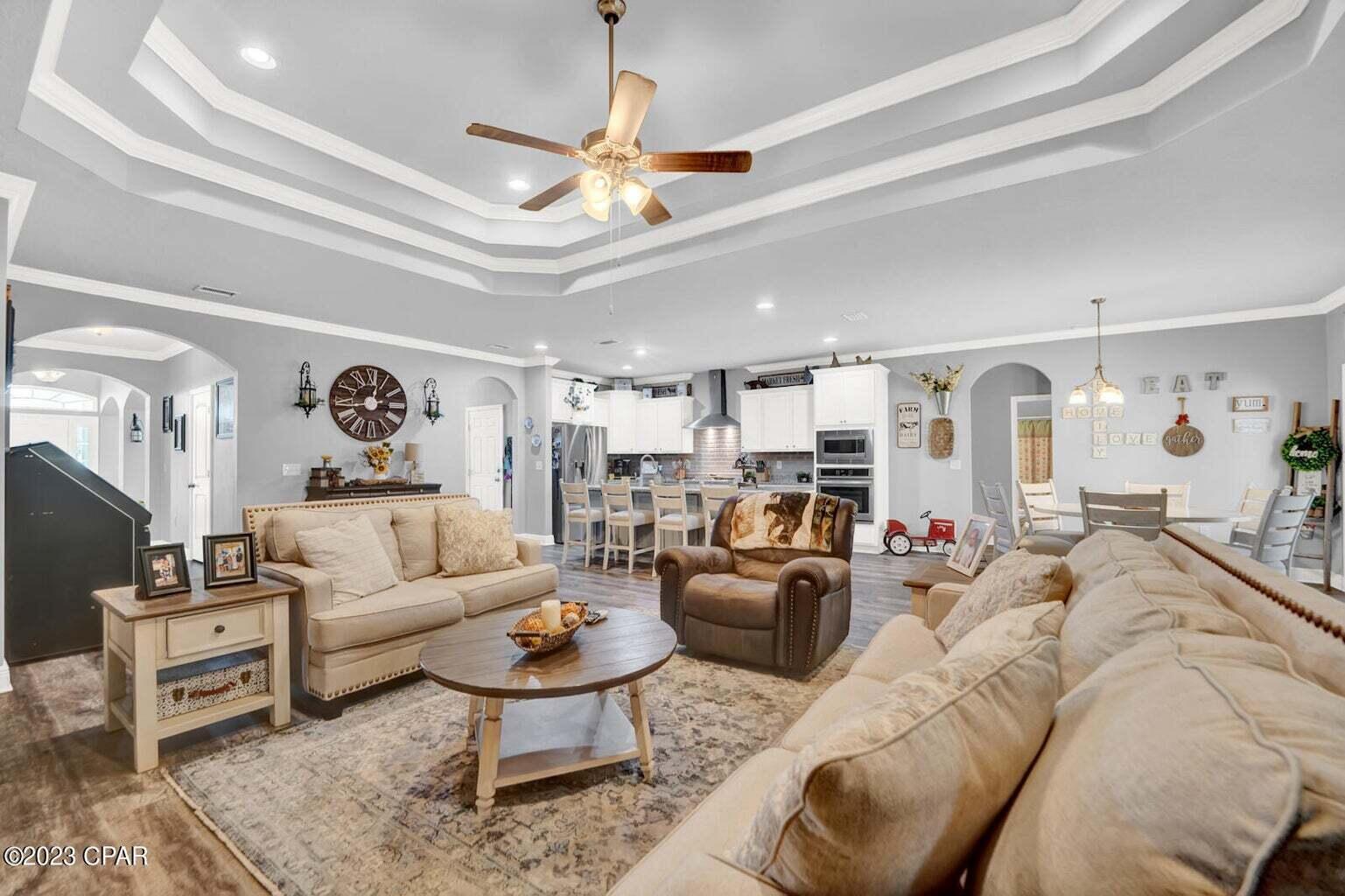 622 Cornelia Street Freeport, FL 32439 - Photo 8 of 43 a living room with furniture and a chandelier