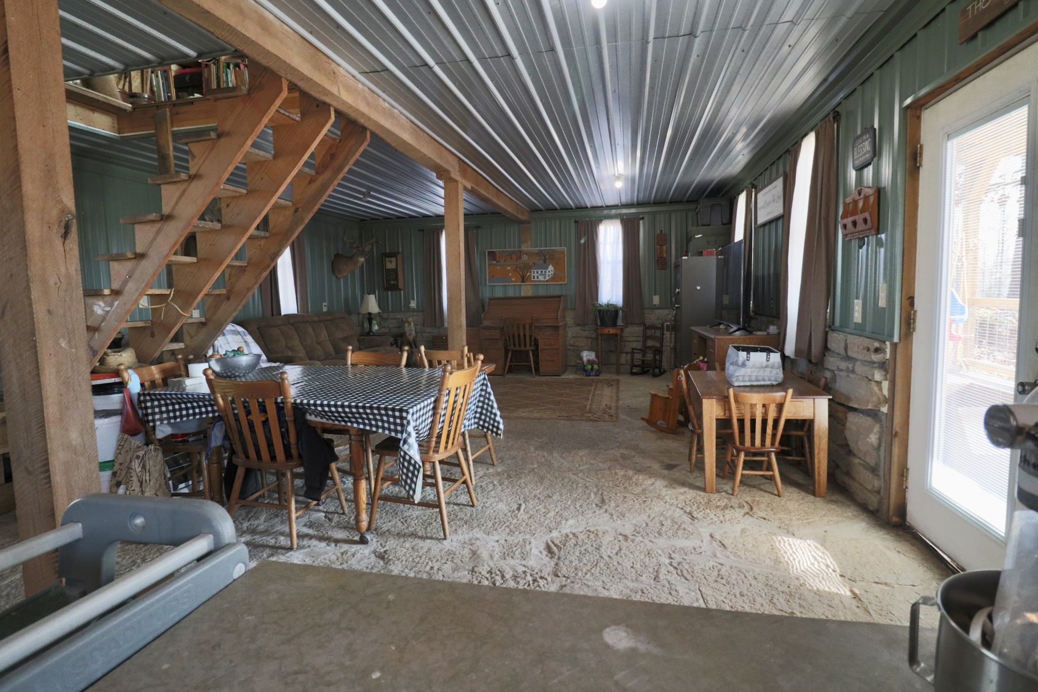 4561 Mayberry Prong Road Linden, TN 37096 - Photo 13 of 27 a dining room with furniture and a floor to ceiling window