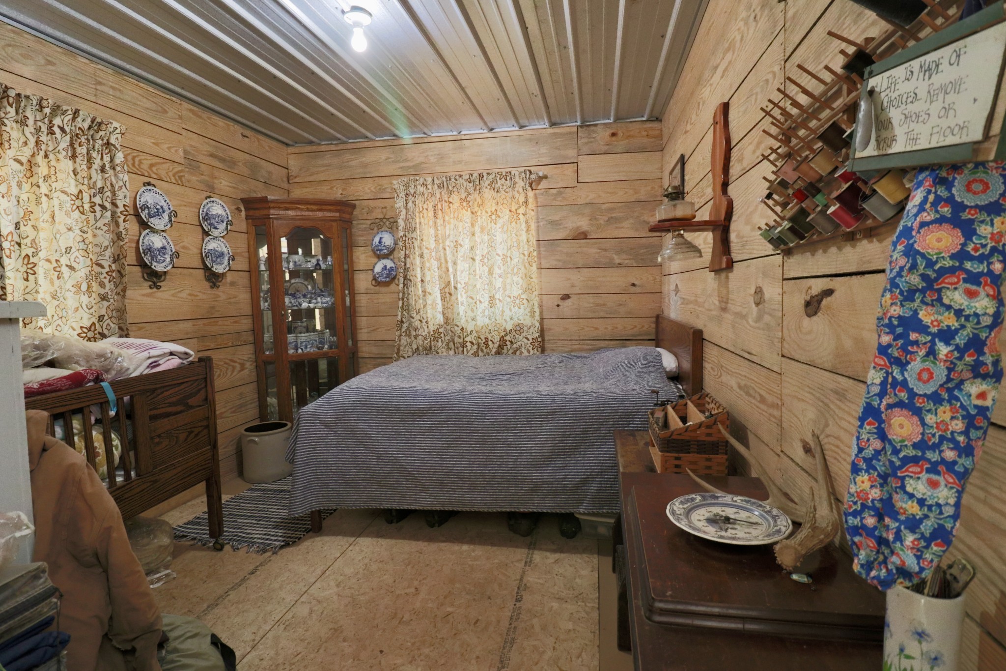 4561 Mayberry Prong Road Linden, TN 37096 - Photo 17 of 27 a bedroom with a bed and a chair