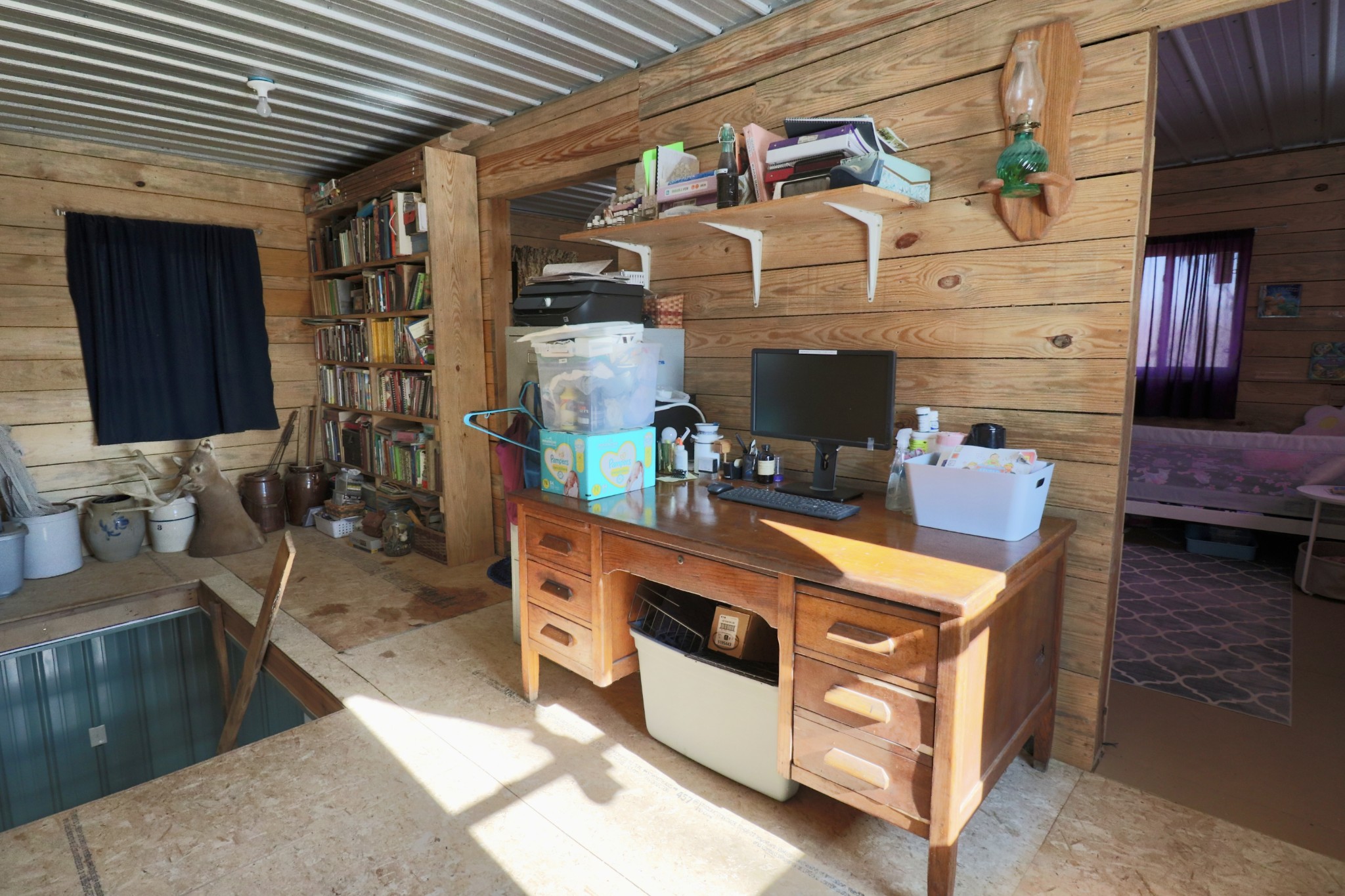 4561 Mayberry Prong Road Linden, TN 37096 - Photo 18 of 27 a kitchen with stainless steel appliances granite countertop a stove and a wooden cabinets