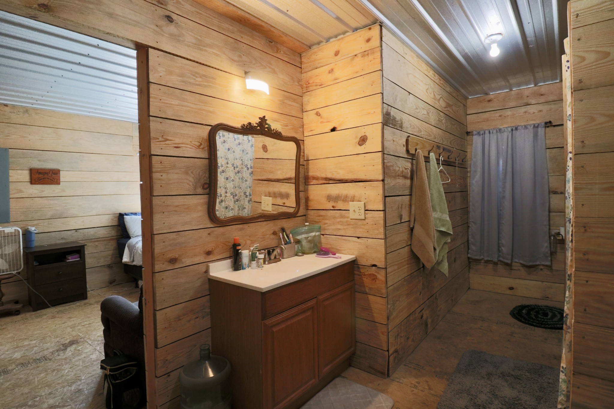4561 Mayberry Prong Road Linden, TN 37096 - Photo 22 of 27 a bathroom with a sink and a mirror