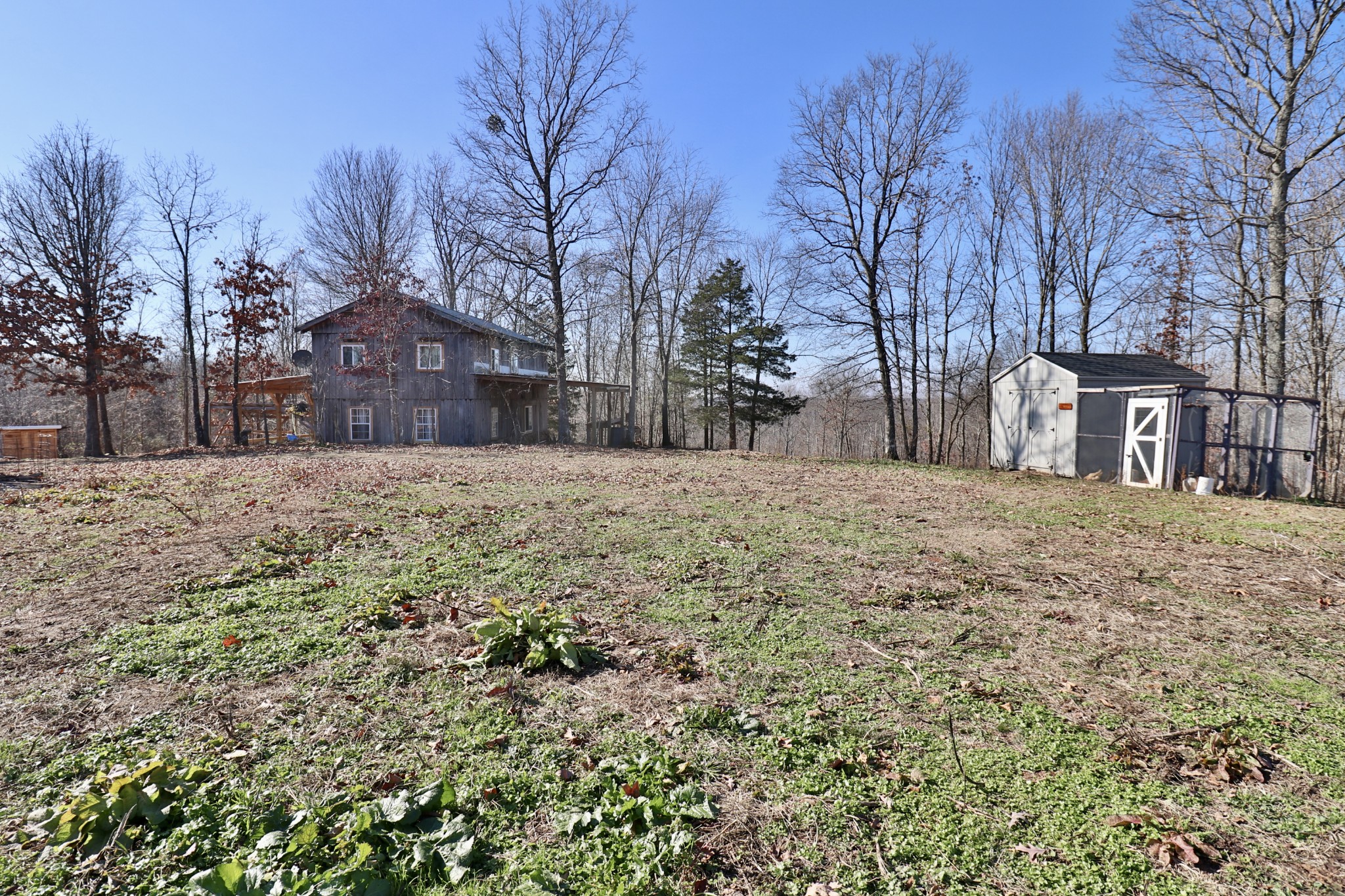 4561 Mayberry Prong Road Linden, TN 37096 - Photo 25 of 27 a view of a yard covered with snow in front of house