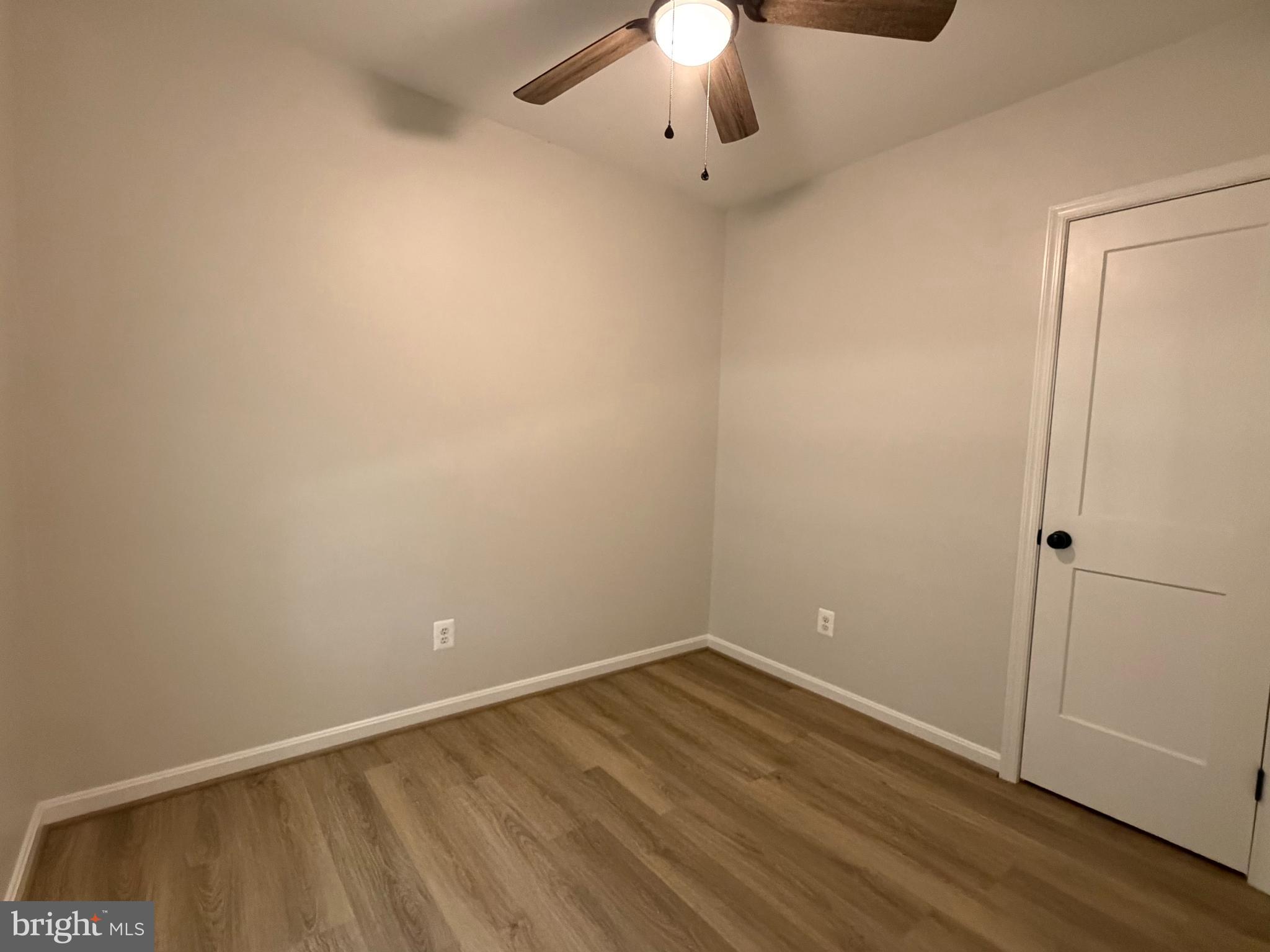 17476 Piney Point Road, Unit 12 Piney Point, MD 20690 - Photo 3 of 10 wooden floor in an empty room