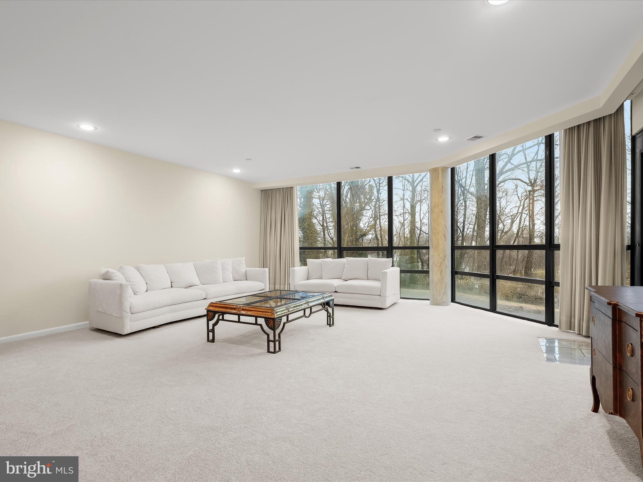 4001 Old Court Road, Unit 115 Baltimore, MD 21208 - Photo 11 of 31 a living room with furniture and large windows