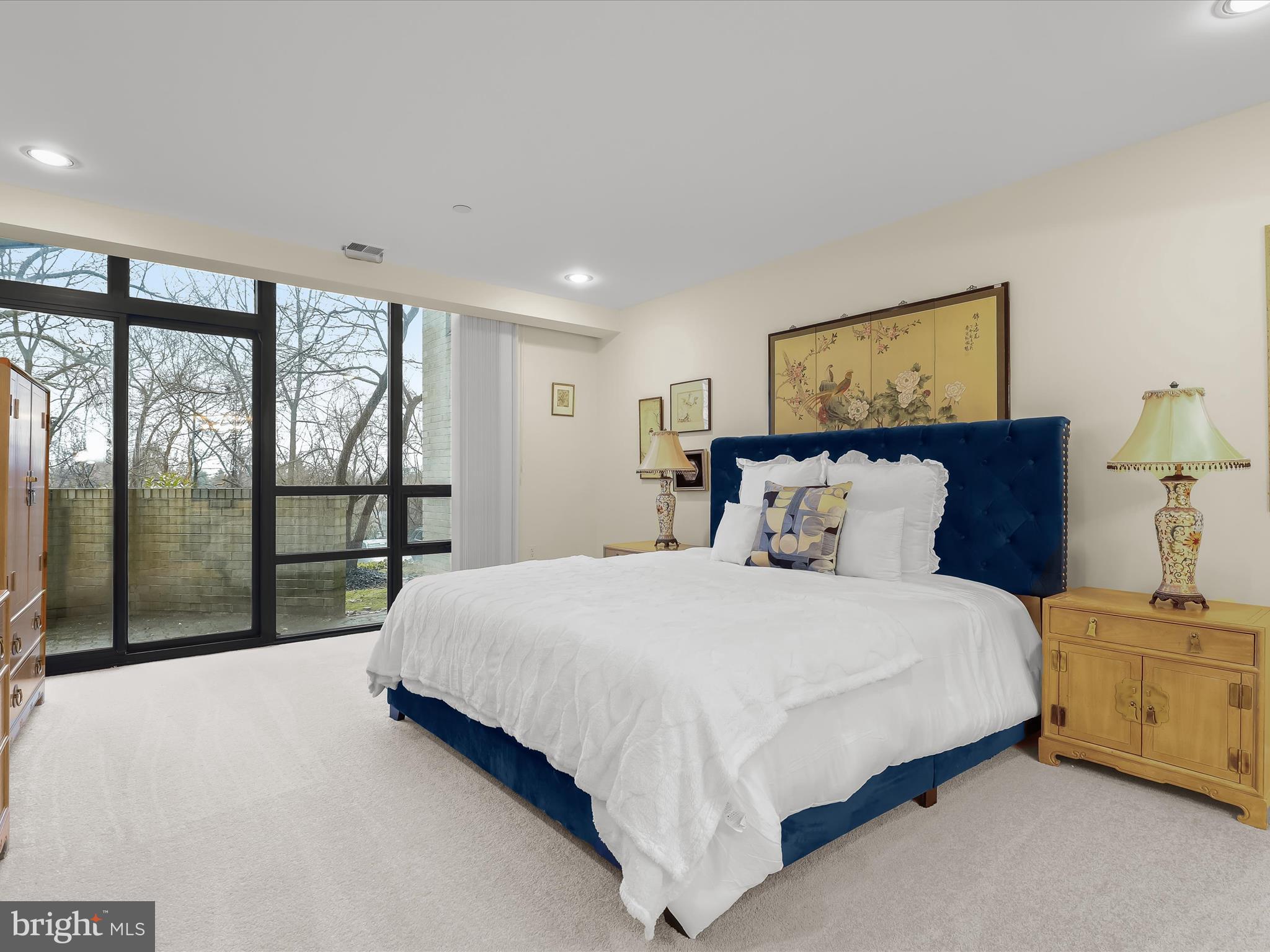 4001 Old Court Road, Unit 115 Baltimore, MD 21208 - Photo 14 of 31 a bedroom with a large bed and a window