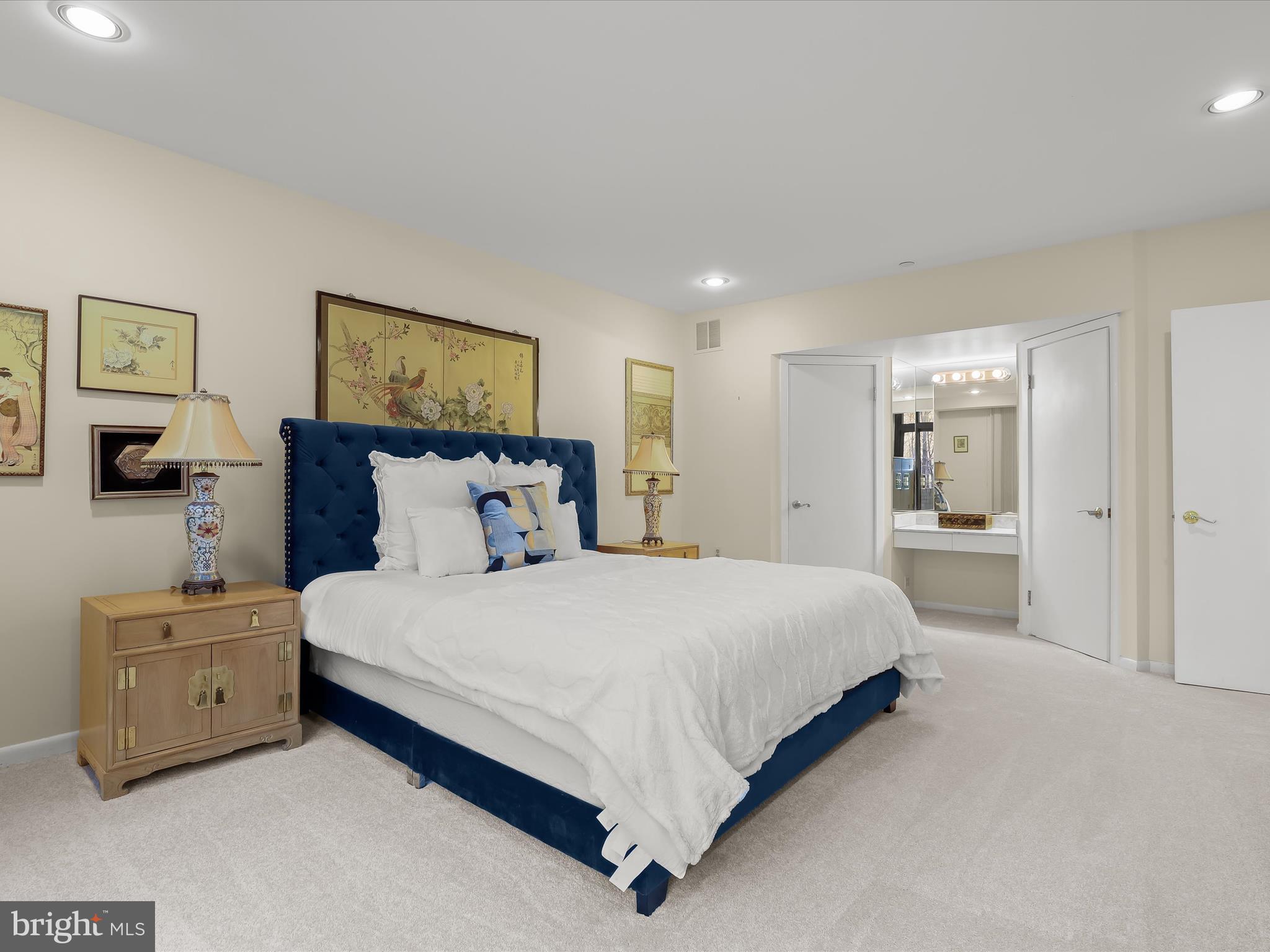 4001 Old Court Road, Unit 115 Baltimore, MD 21208 - Photo 17 of 31 a spacious bedroom with a bed and a painting on the wall