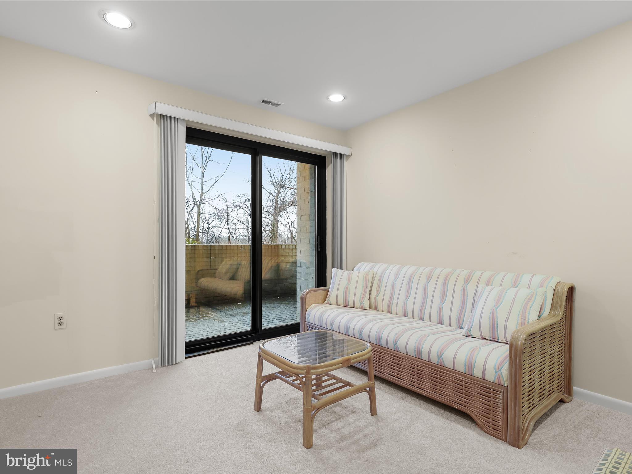 4001 Old Court Road, Unit 115 Baltimore, MD 21208 - Photo 21 of 31 a living room with furniture and a floor to ceiling window