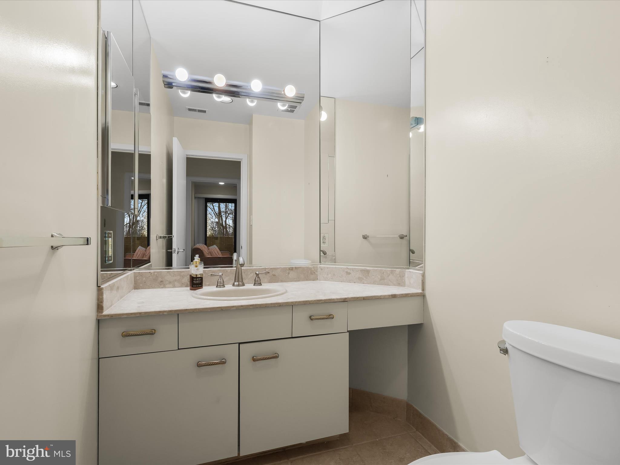 4001 Old Court Road, Unit 115 Baltimore, MD 21208 - Photo 22 of 31 a bathroom with a sink and a mirror