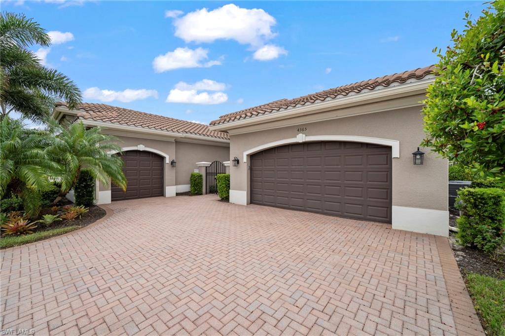 4365 Caldera Circle Naples, FL 34119 - Photo 18 of 23 Mediterranean / spanish-style house with a garage