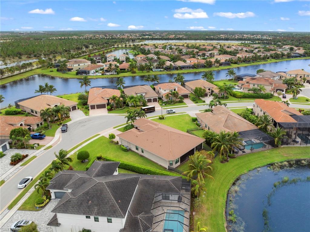 4365 Caldera Circle Naples, FL 34119 - Photo 20 of 23 Drone / aerial view featuring a water view