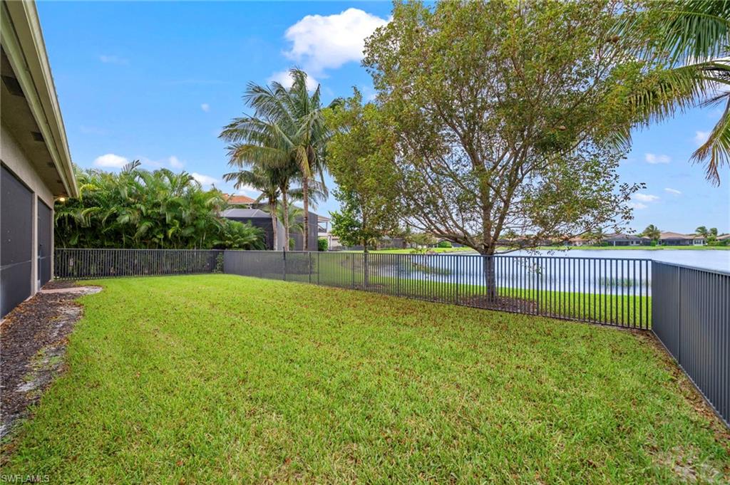 4365 Caldera Circle Naples, FL 34119 - Photo 22 of 23 View of yard with a water view