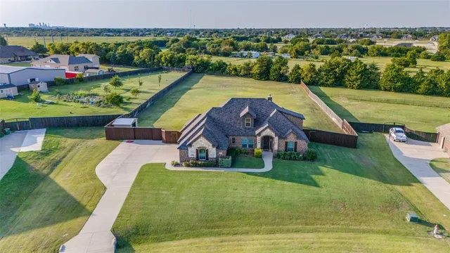 swimming pool view with a garden and ocean view