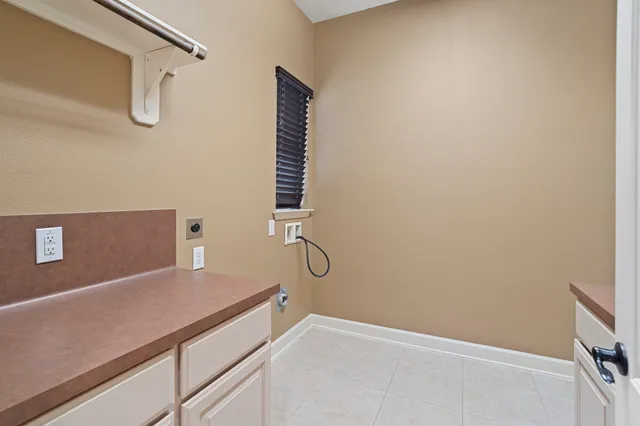 a room with a white wall and a window