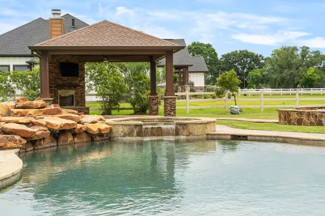 a view of a swimming pool with a patio
