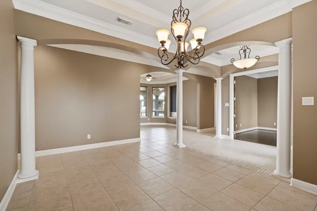 a view of a chandelier and a chandelier in a room