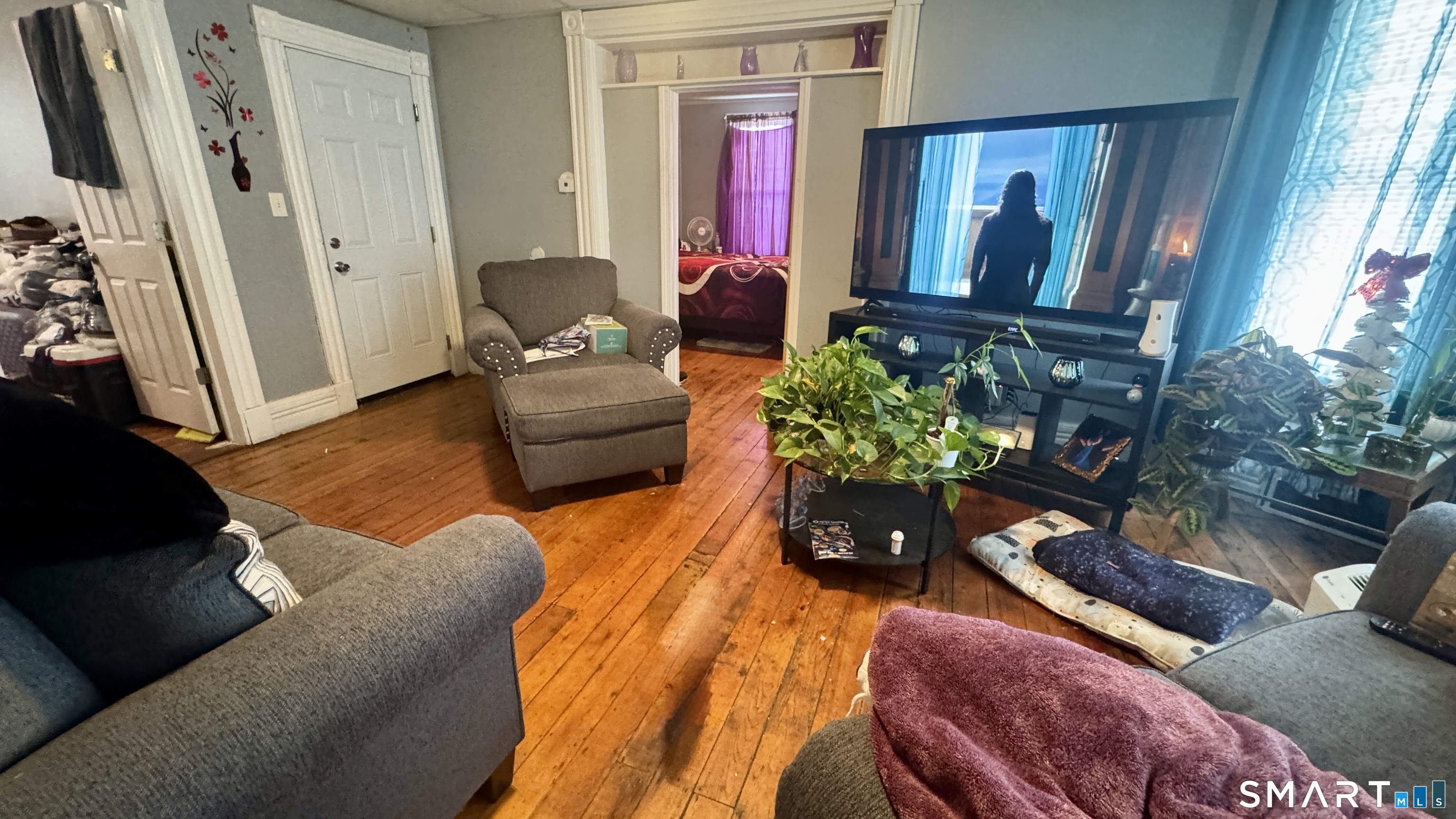 61 Randolph Avenue Meriden, CT 06451 - Photo 12 of 40 a living room with furniture and a flat screen tv