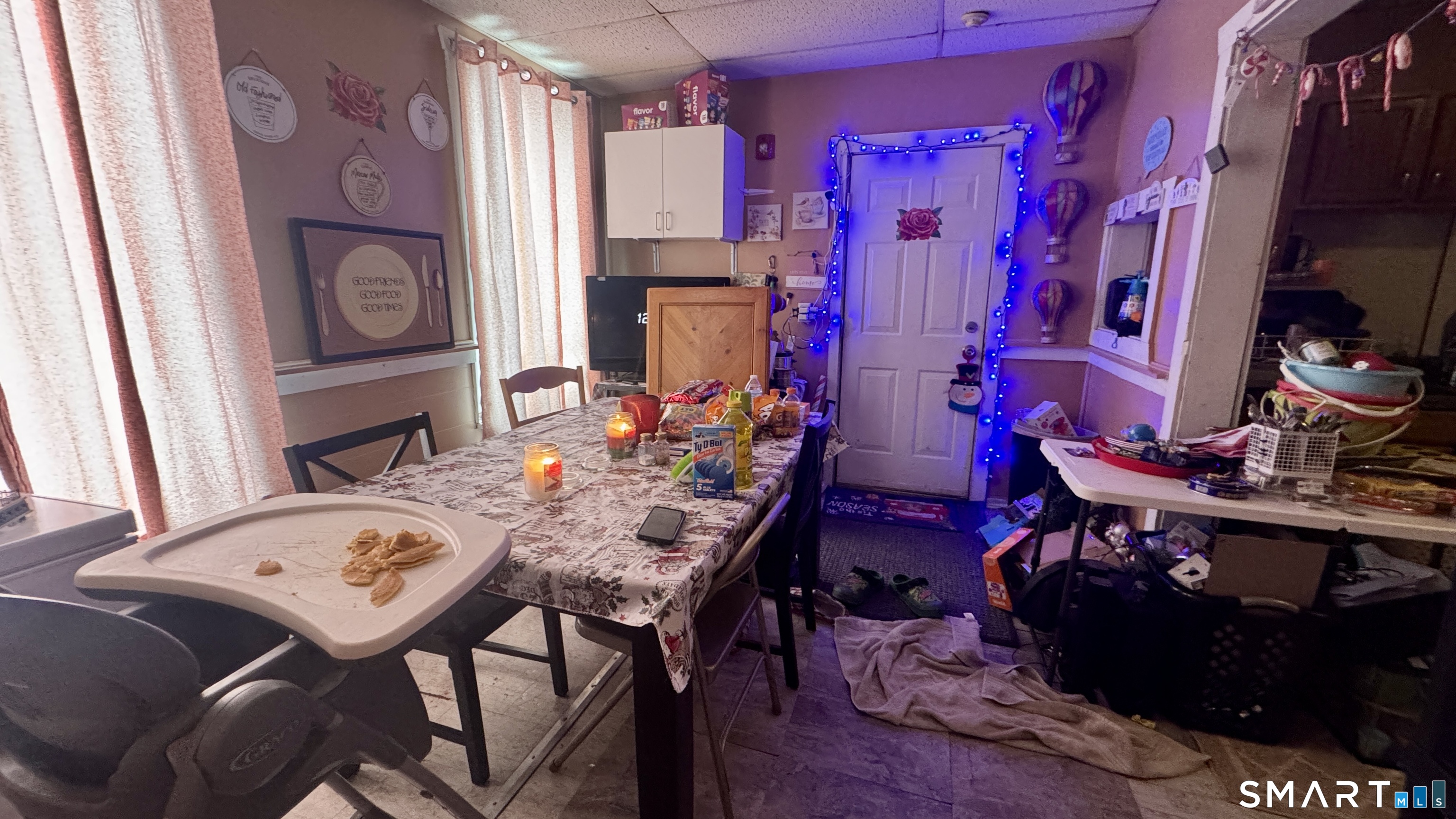 61 Randolph Avenue Meriden, CT 06451 - Photo 15 of 40 a view of a dining room with furniture and a chandelier