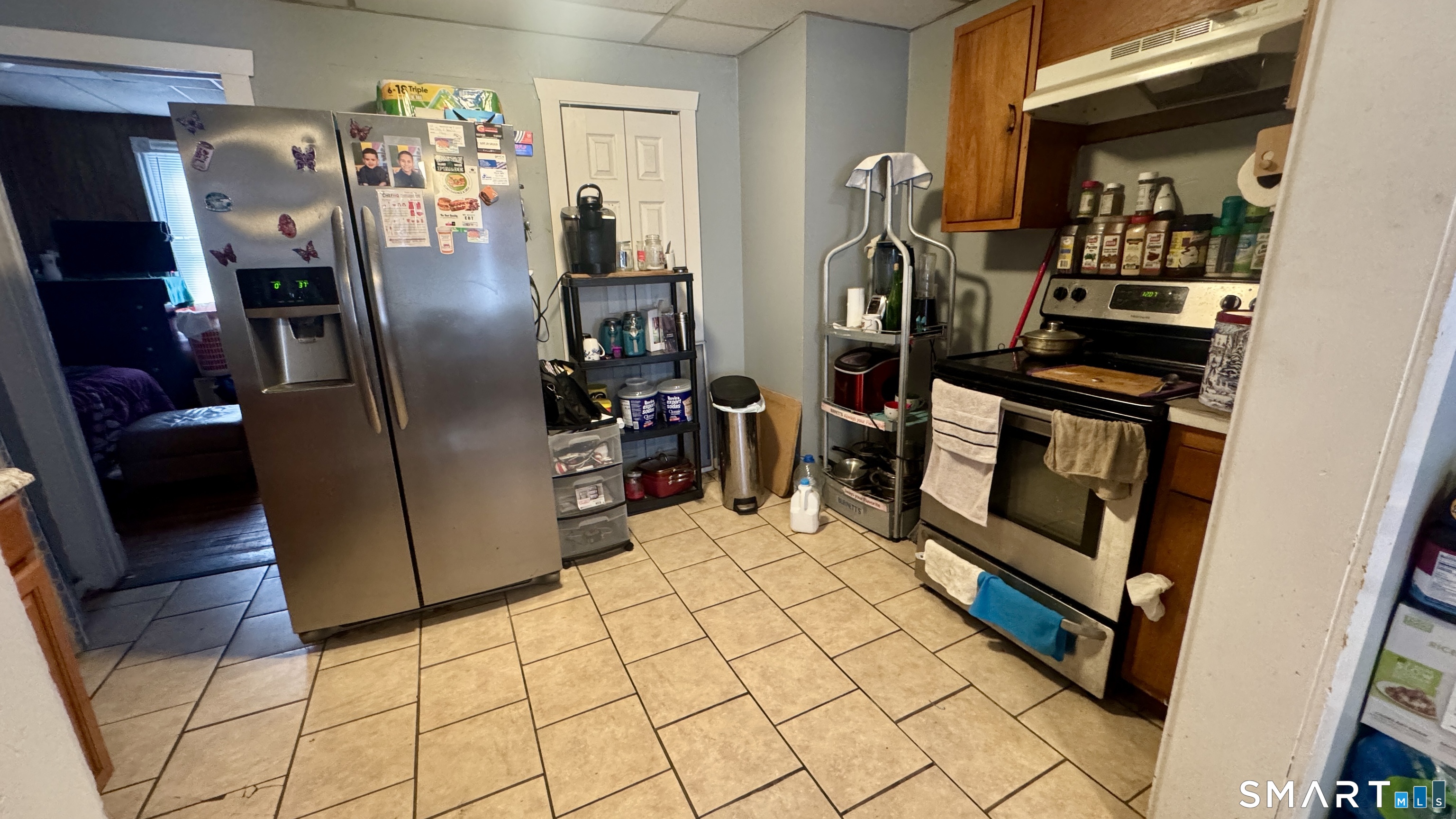 61 Randolph Avenue Meriden, CT 06451 - Photo 18 of 40 a kitchen with stainless steel appliances granite countertop a refrigerator and a stove