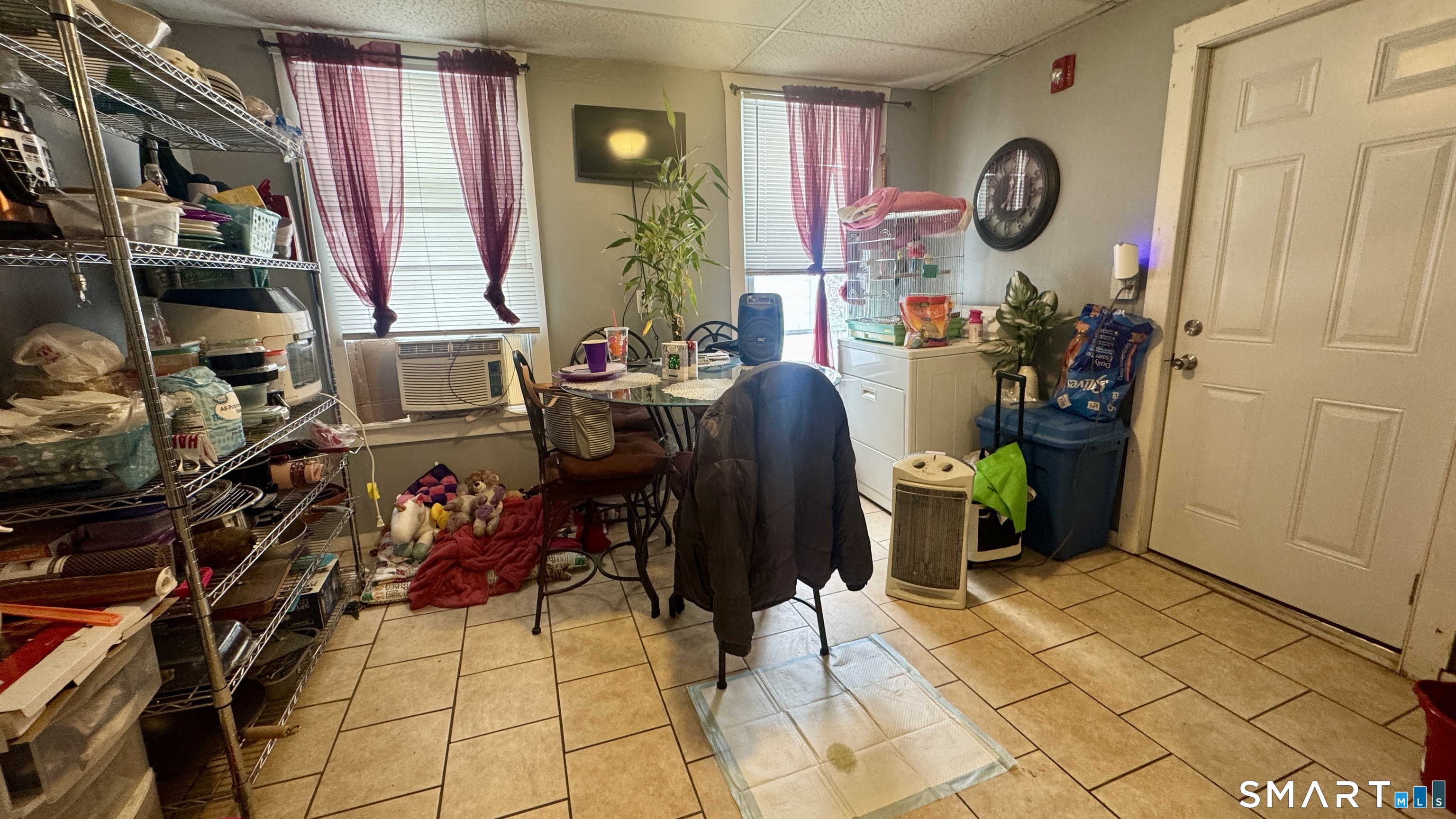 61 Randolph Avenue Meriden, CT 06451 - Photo 19 of 40 a room with lots of different colored cloths