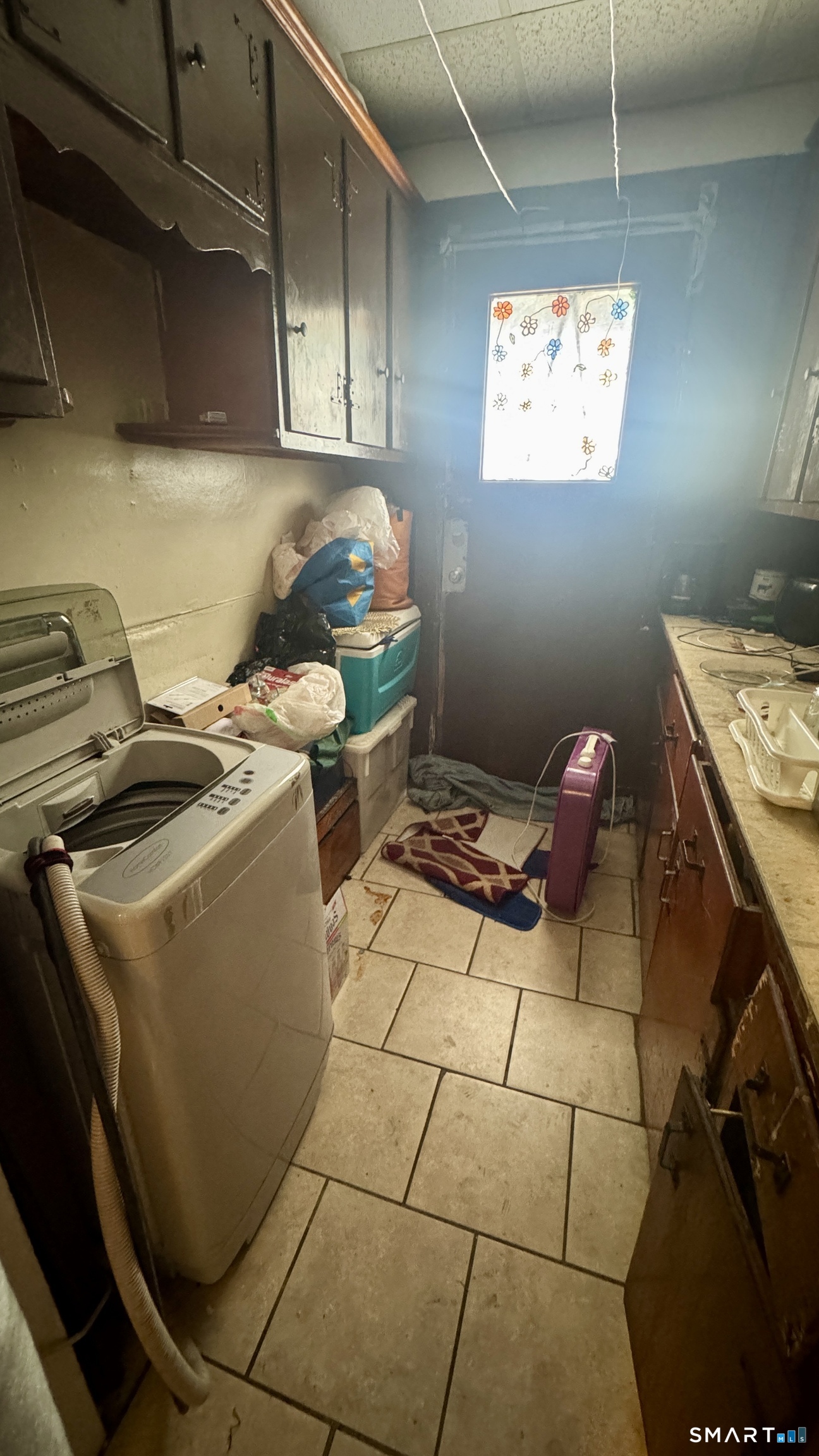 61 Randolph Avenue Meriden, CT 06451 - Photo 23 of 40 a room with water heater and a cabinet