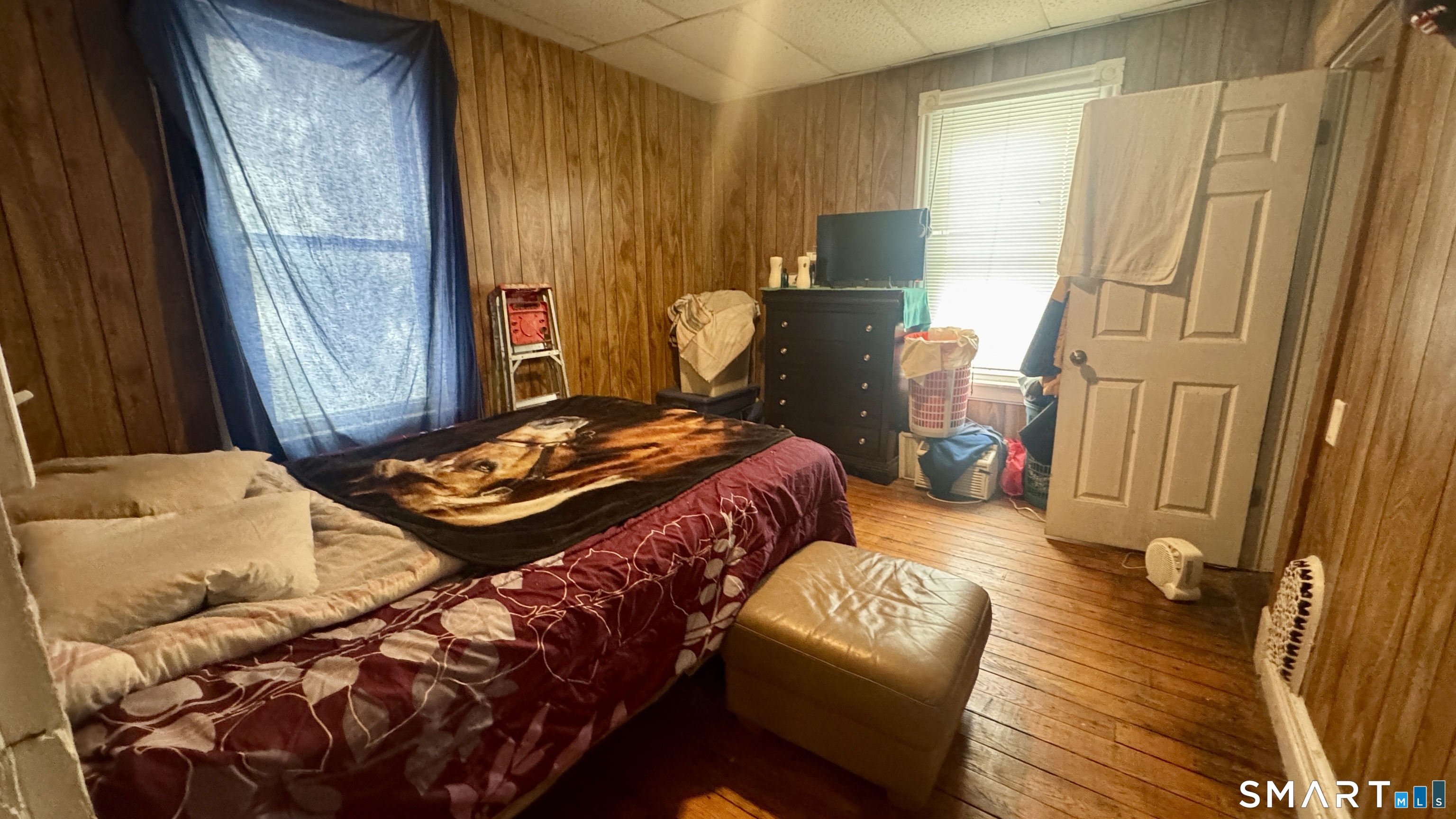 61 Randolph Avenue Meriden, CT 06451 - Photo 24 of 40 a bedroom with a bed and wooden floor