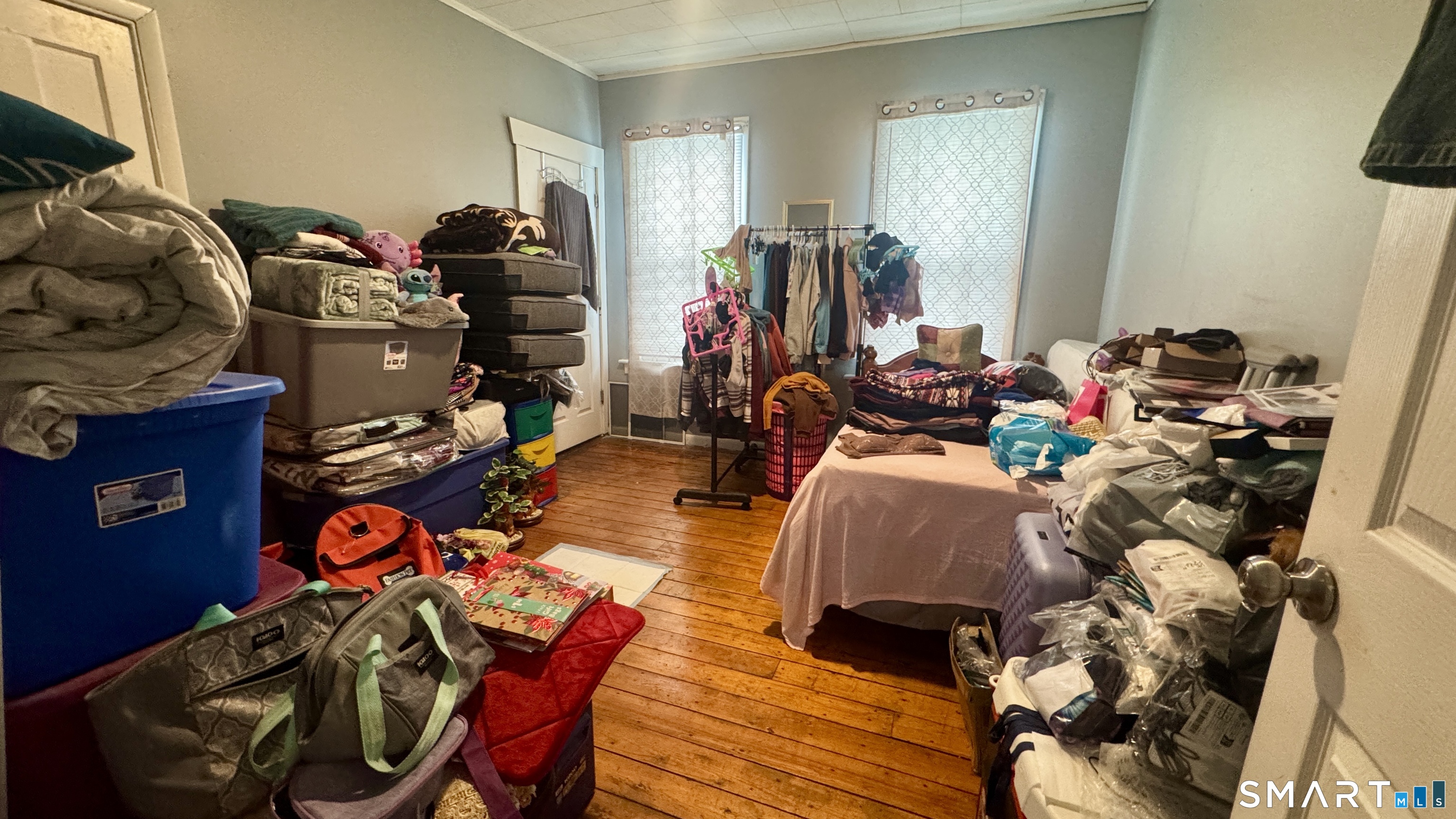 61 Randolph Avenue Meriden, CT 06451 - Photo 25 of 40 a living room with lots of furniture and a gym equipment