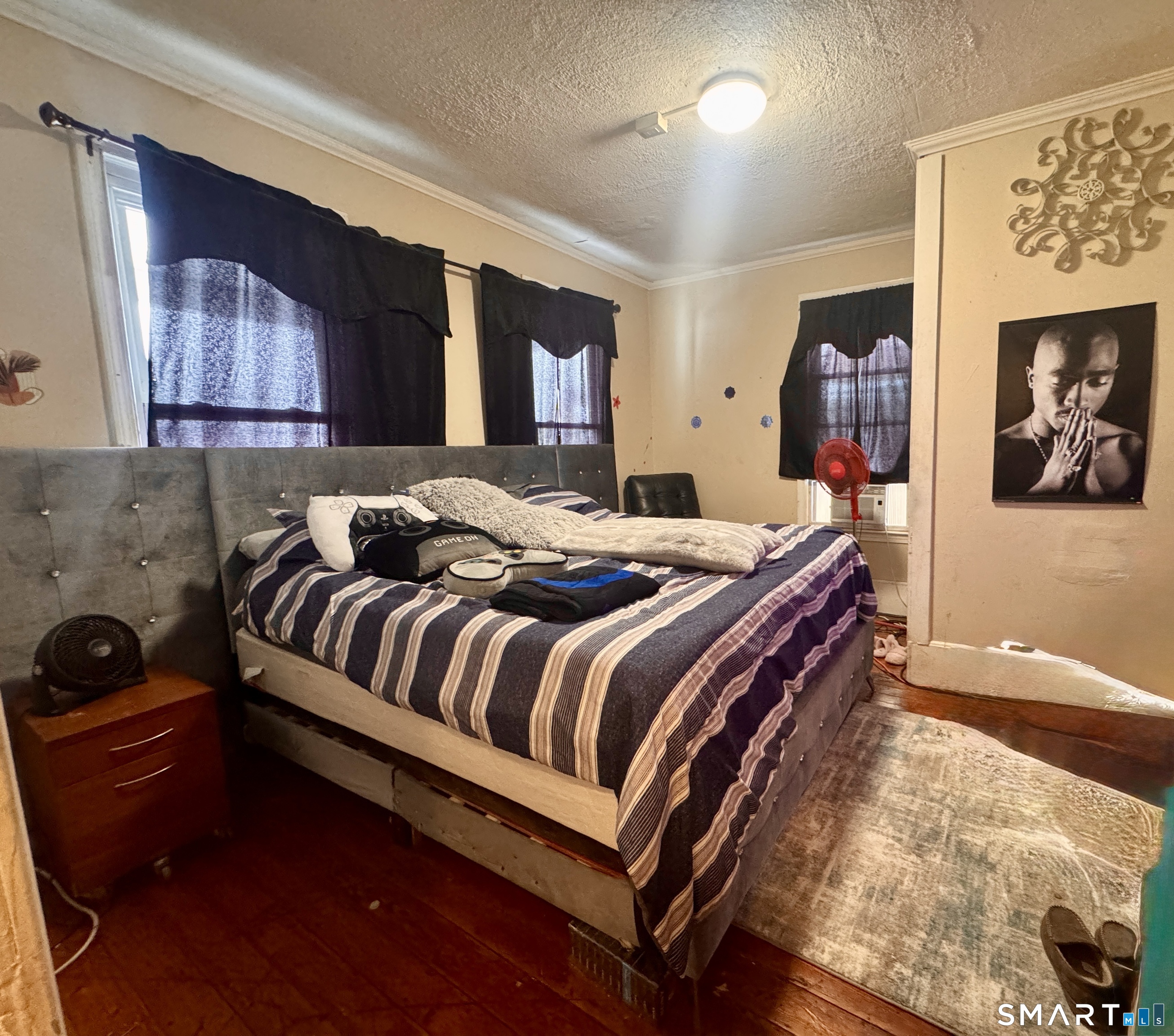 61 Randolph Avenue Meriden, CT 06451 - Photo 35 of 40 a bedroom with a bed and dresser