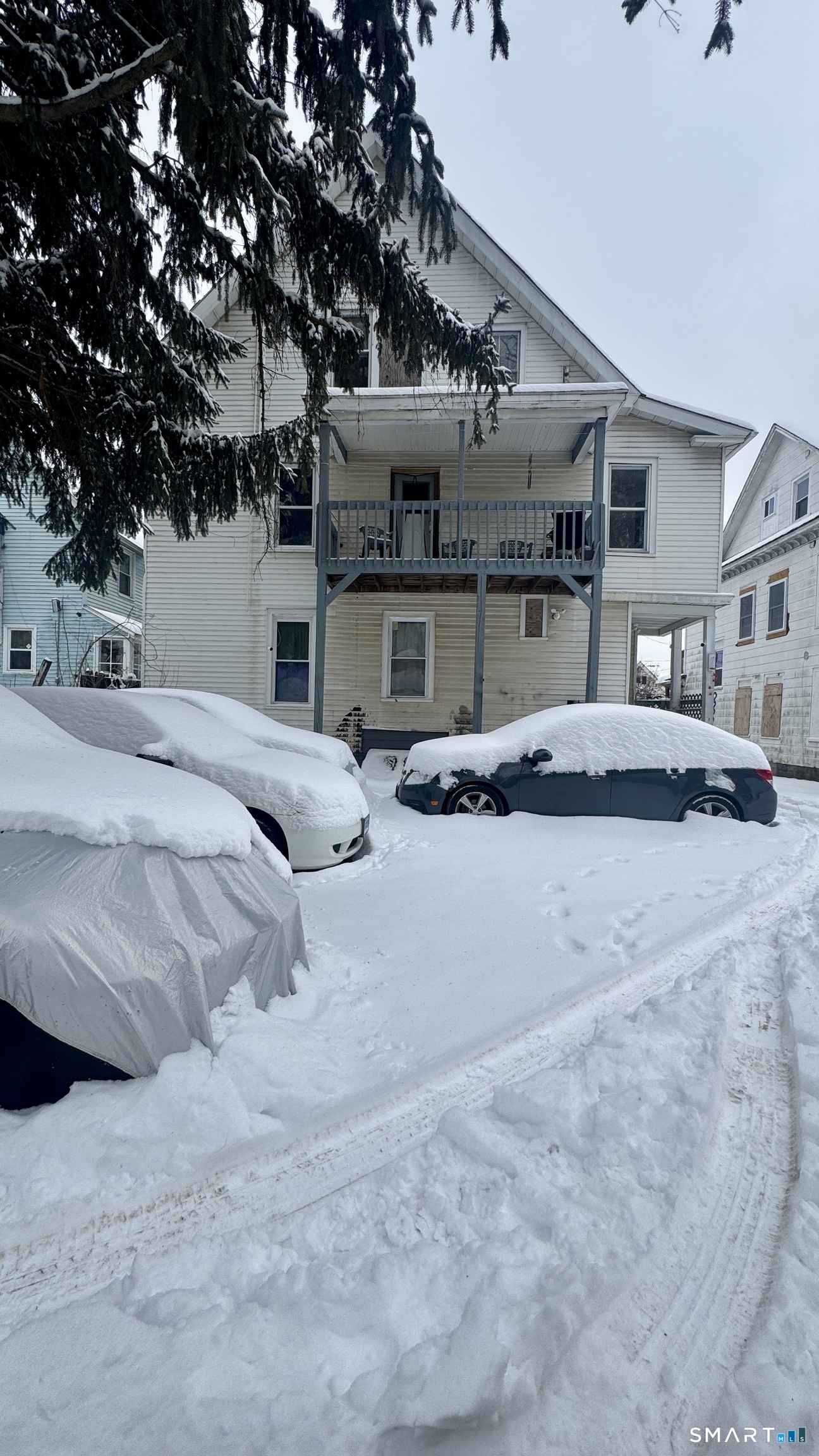 61 Randolph Avenue Meriden, CT 06451 - Photo 10 of 40 a view of a house with a snow in front of it