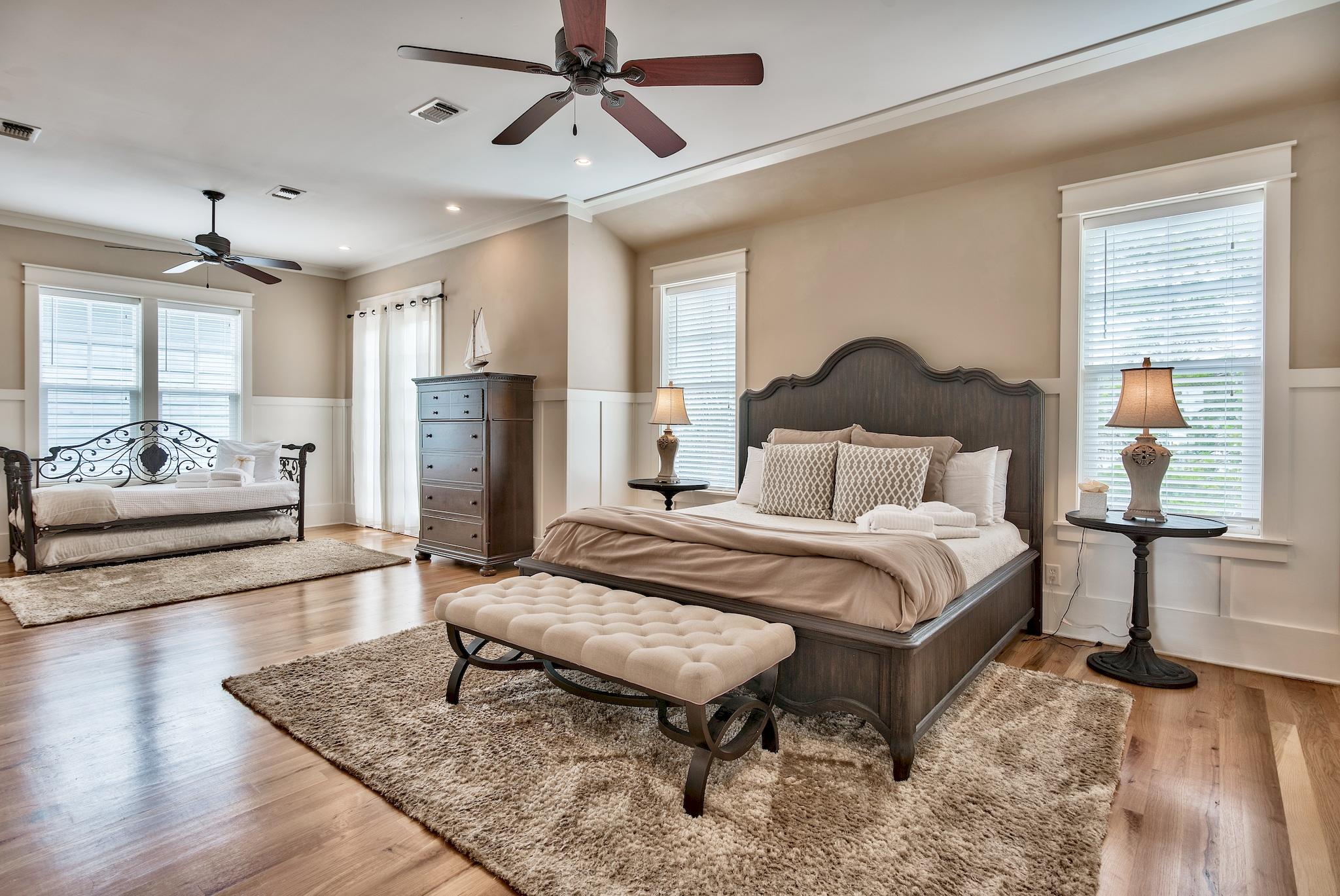 8045 East County Highway 30A Inlet Beach, FL 32461 - Photo 11 of 38 a bedroom with a bed and wooden floor