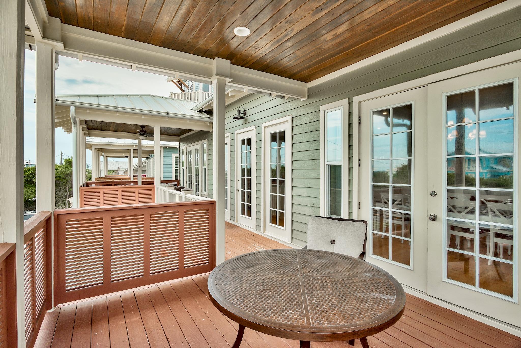 8045 East County Highway 30A Inlet Beach, FL 32461 - Photo 12 of 38 a view of a porch with furniture
