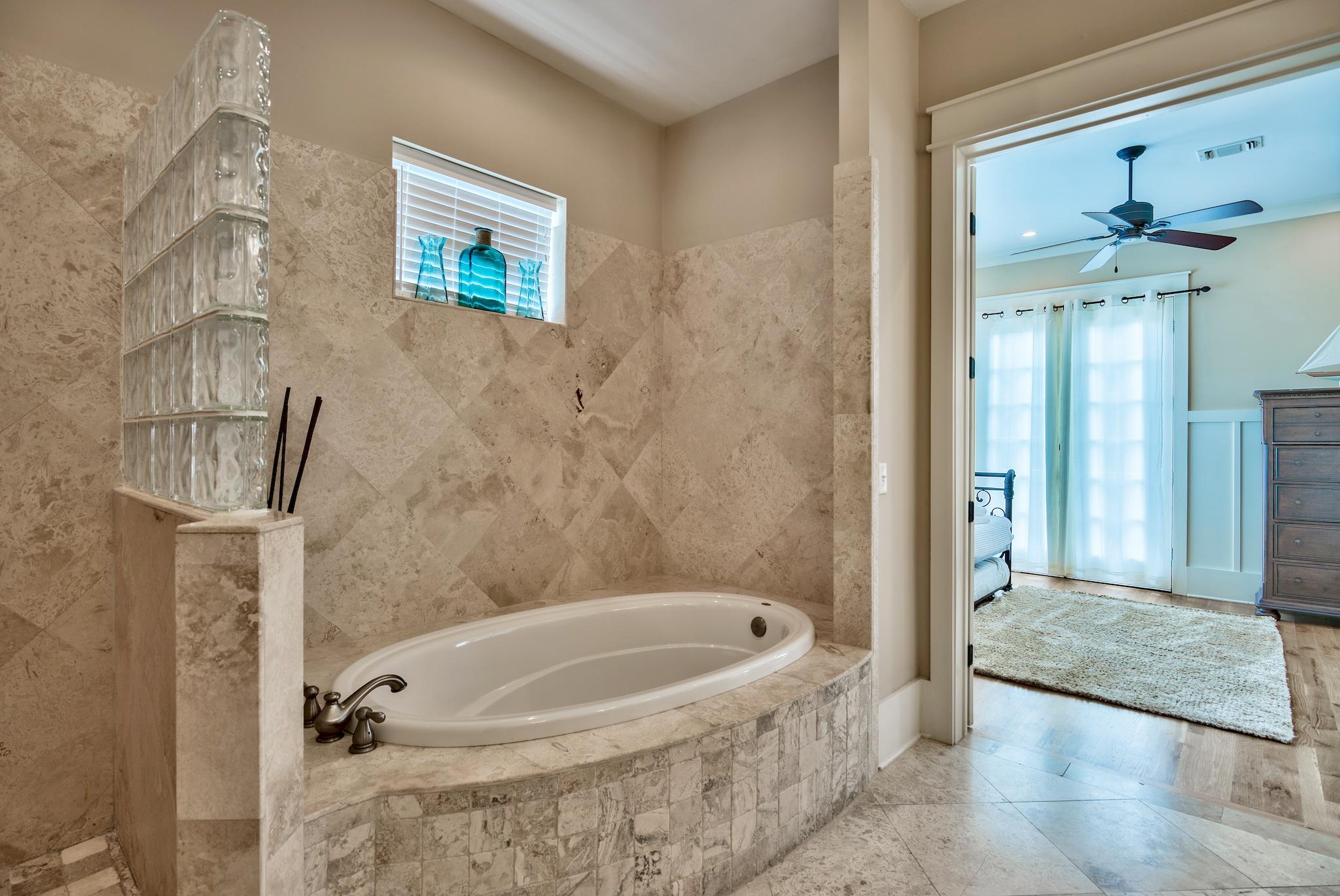 8045 East County Highway 30A Inlet Beach, FL 32461 - Photo 13 of 38 a bathroom with a tub and shower