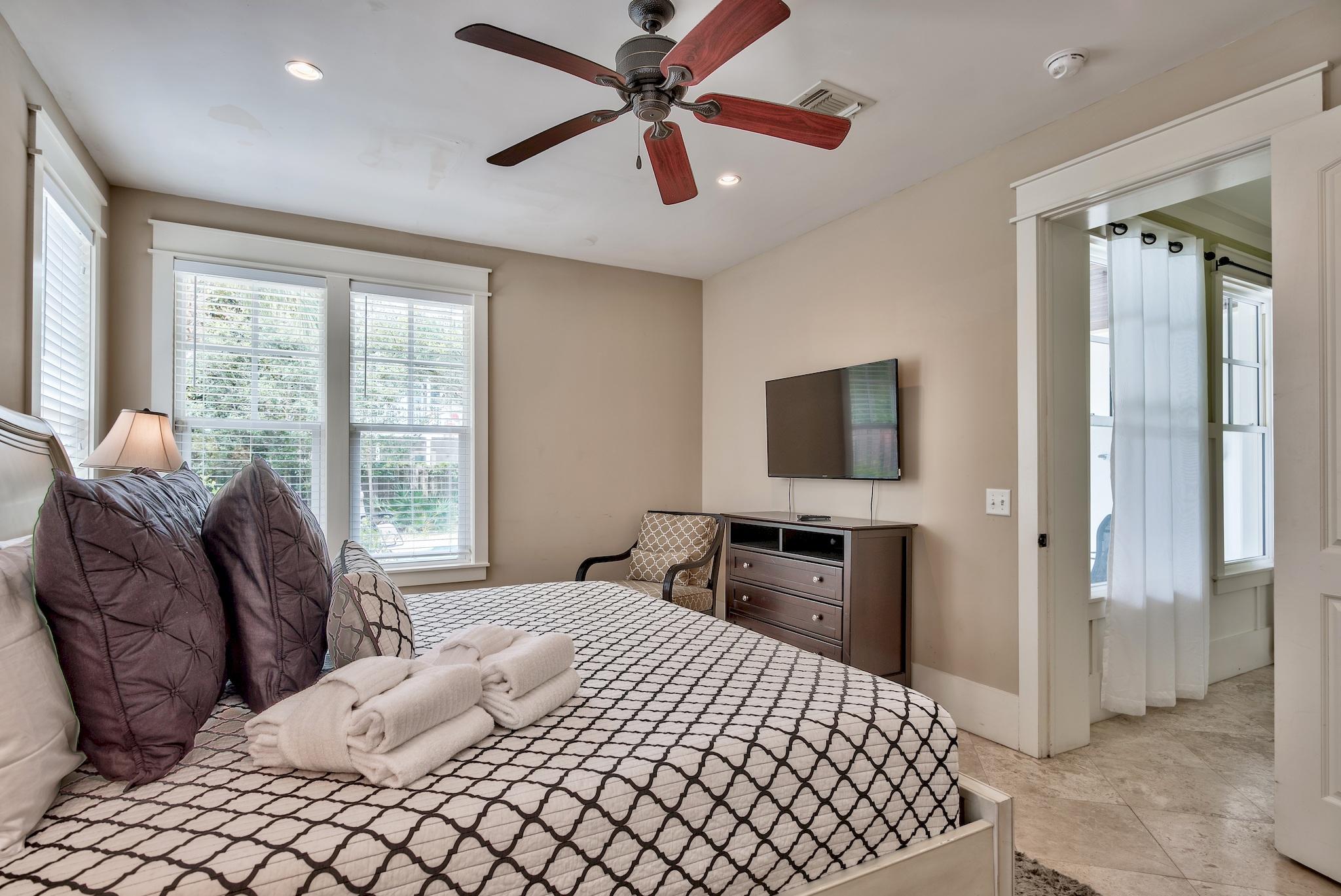 8045 East County Highway 30A Inlet Beach, FL 32461 - Photo 15 of 38 a bedroom with a bed and a television