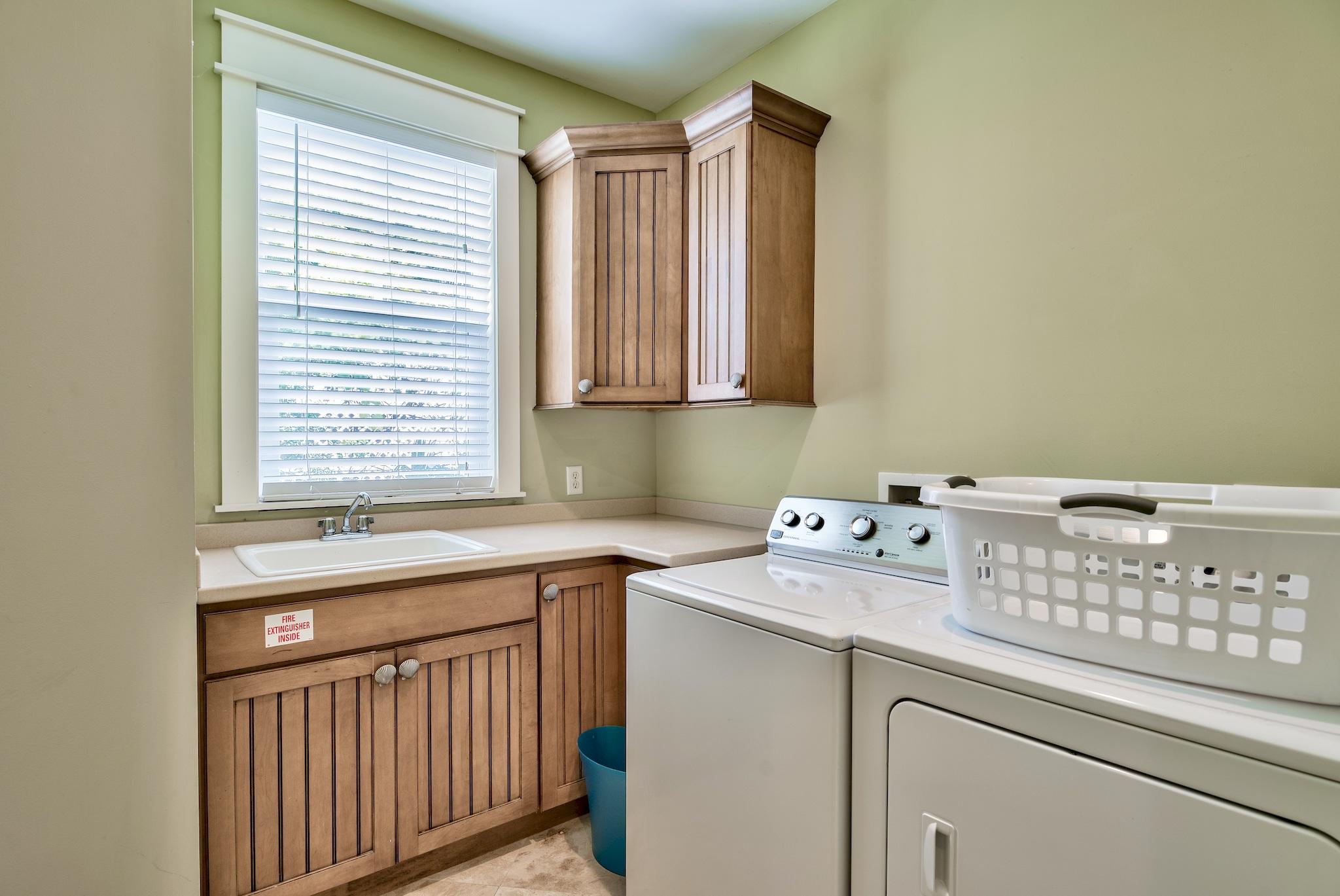8045 East County Highway 30A Inlet Beach, FL 32461 - Photo 17 of 38 a utility room with a sink washer and dryer