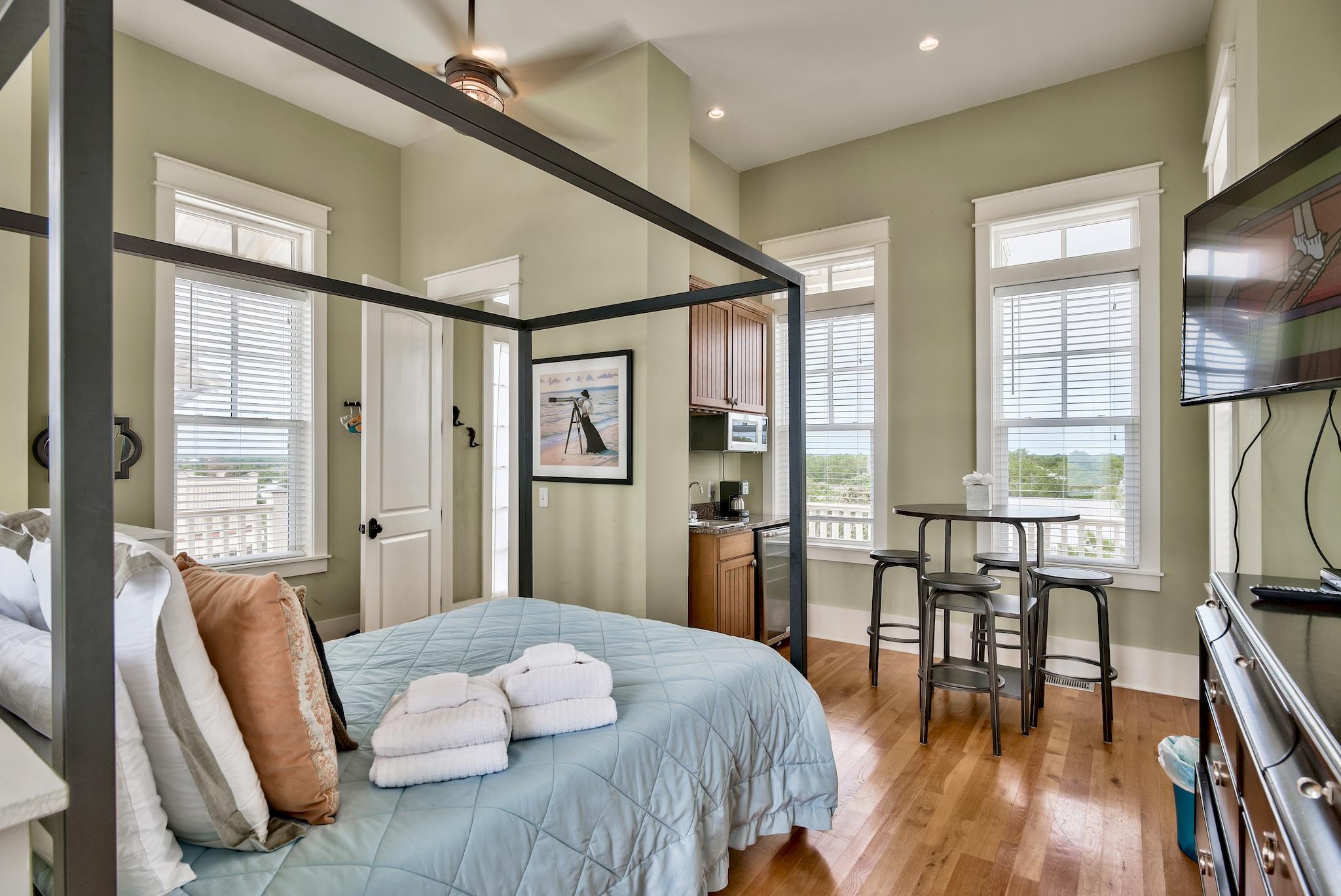 8045 East County Highway 30A Inlet Beach, FL 32461 - Photo 18 of 38 a bedroom with a bed furniture and a large window