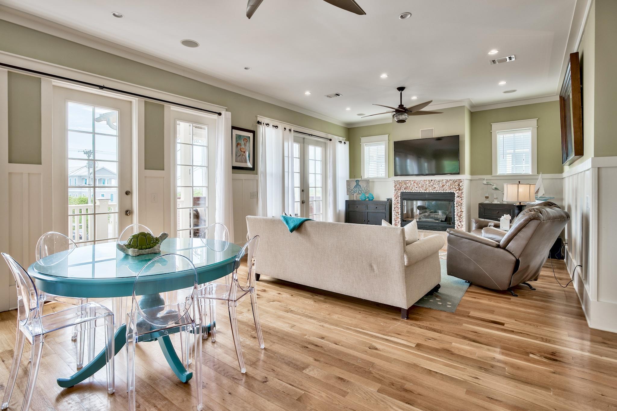 8045 East County Highway 30A Inlet Beach, FL 32461 - Photo 20 of 38 a living room with fireplace furniture and a large window