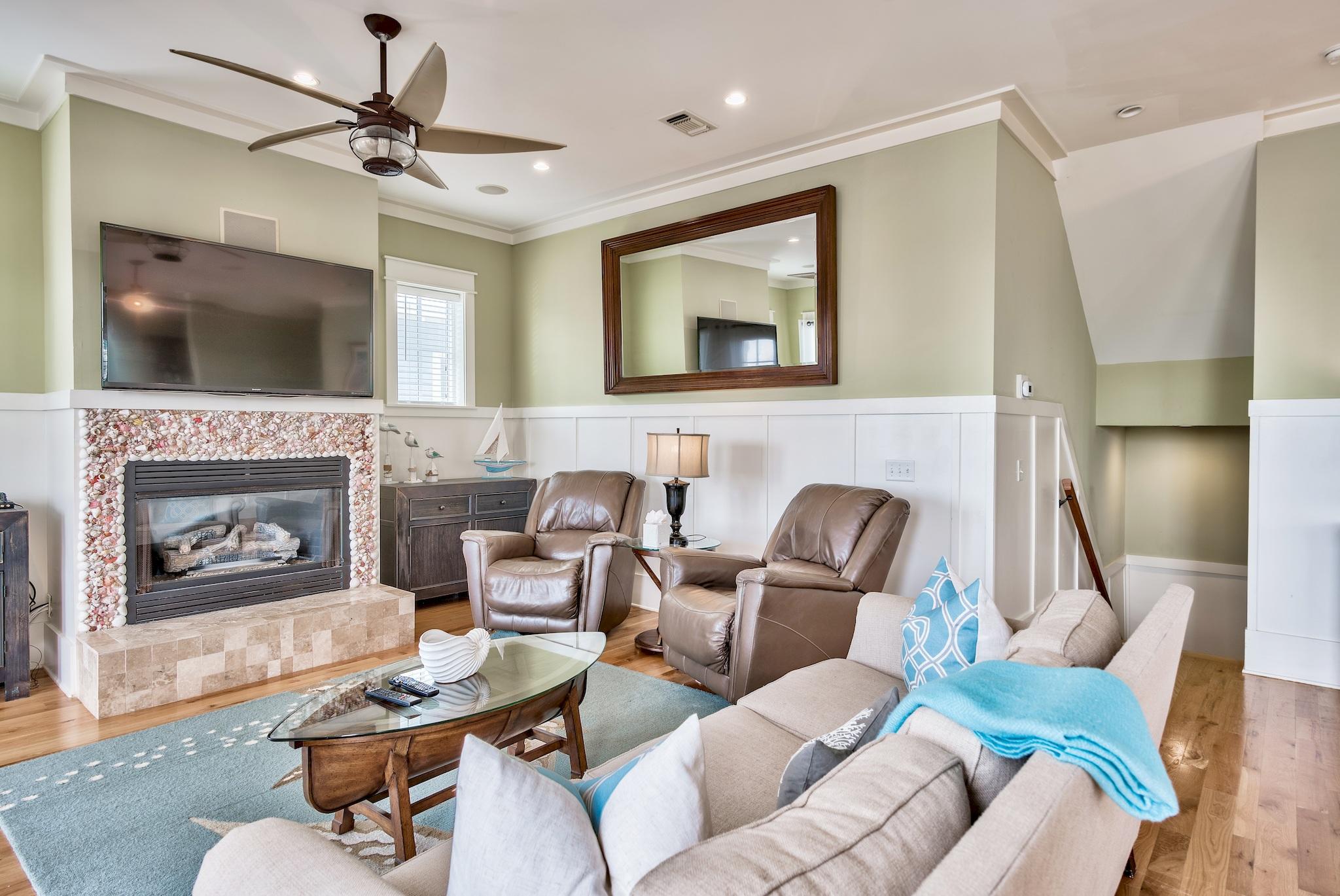 8045 East County Highway 30A Inlet Beach, FL 32461 - Photo 21 of 38 a living room with furniture and a fireplace