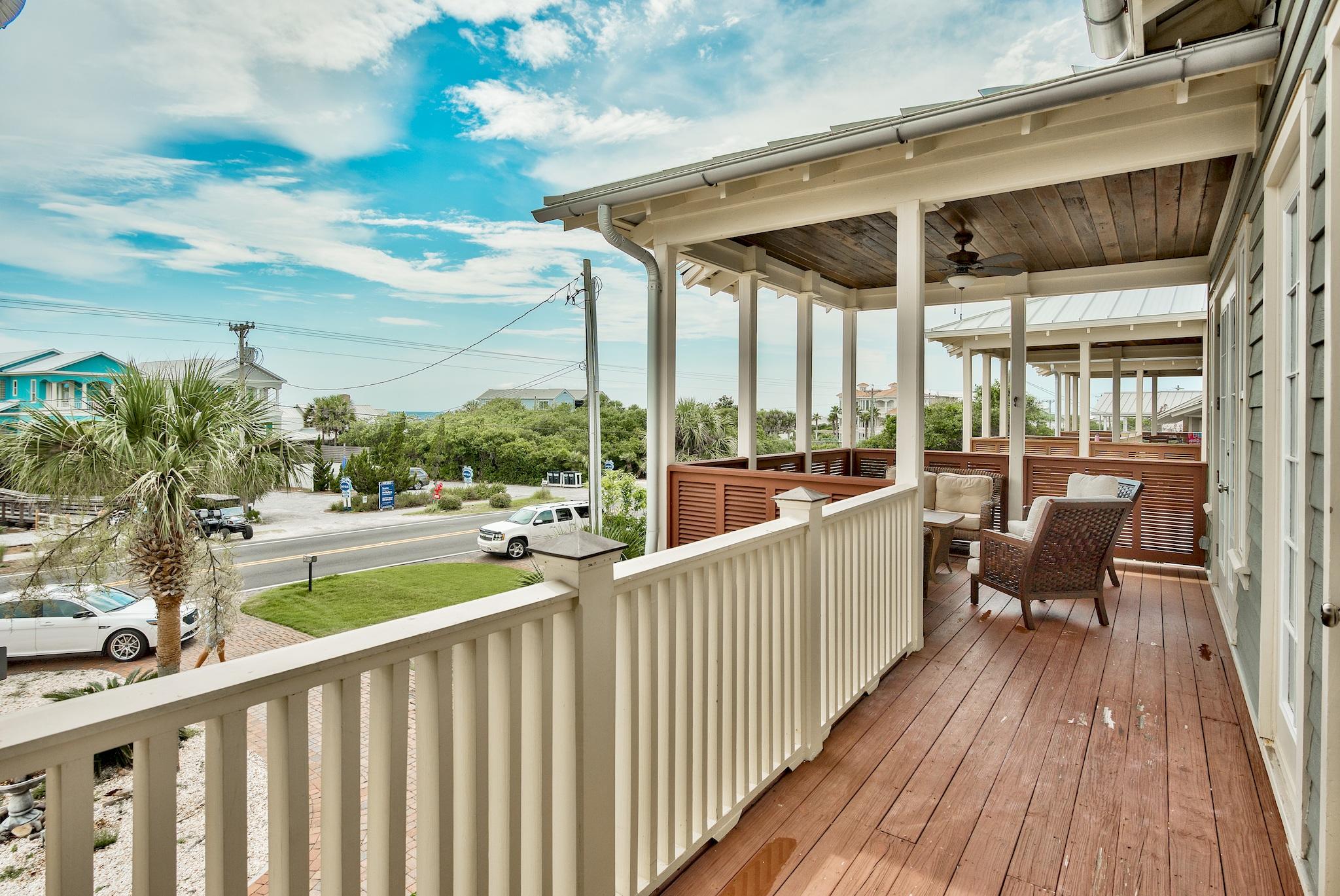8045 East County Highway 30A Inlet Beach, FL 32461 - Photo 22 of 38 a view of a chair and tables in the balcony