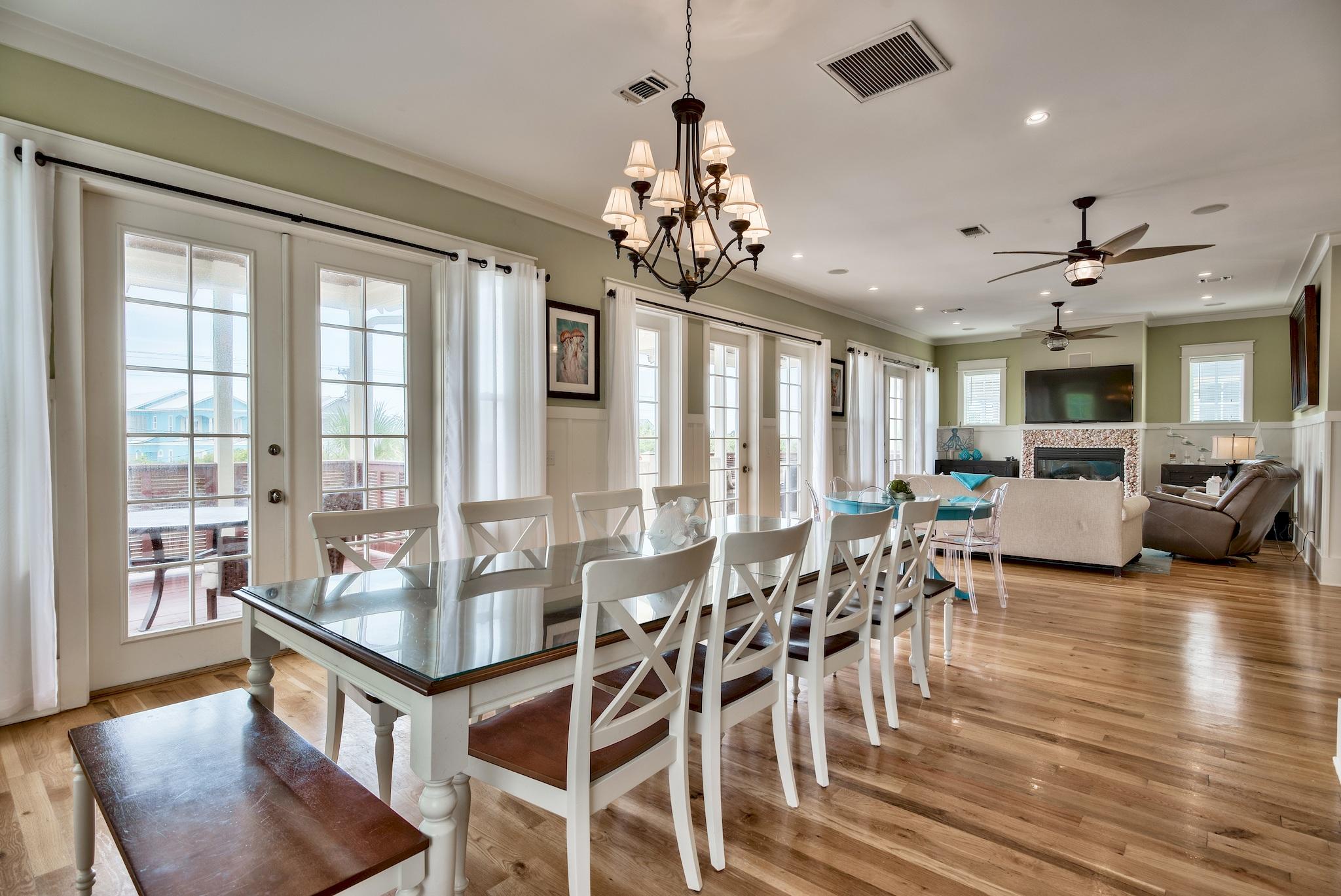 8045 East County Highway 30A Inlet Beach, FL 32461 - Photo 23 of 38 a view of a dining room with furniture window and wooden floor