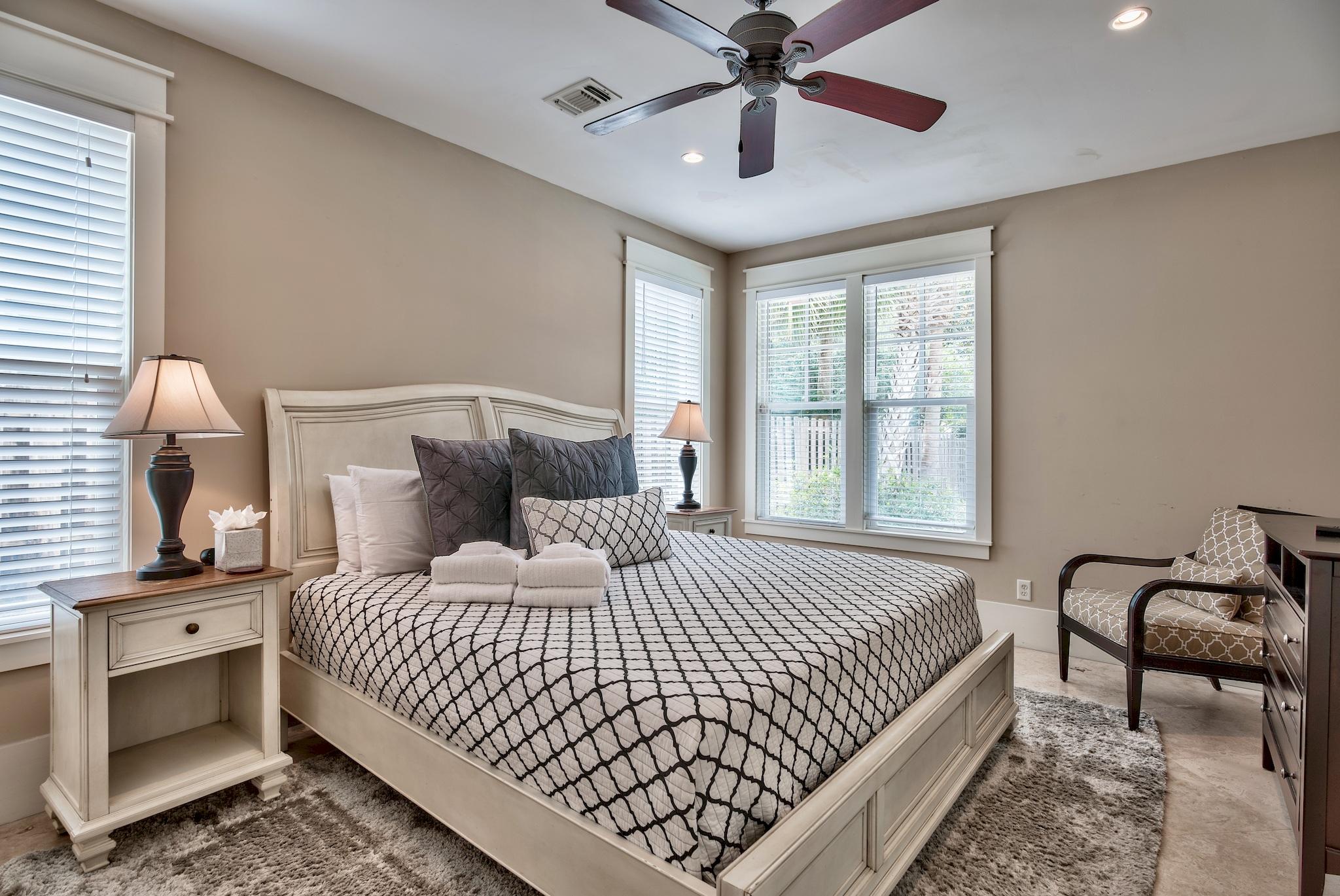 8045 East County Highway 30A Inlet Beach, FL 32461 - Photo 26 of 38 a bedroom with a bed and a chandelier