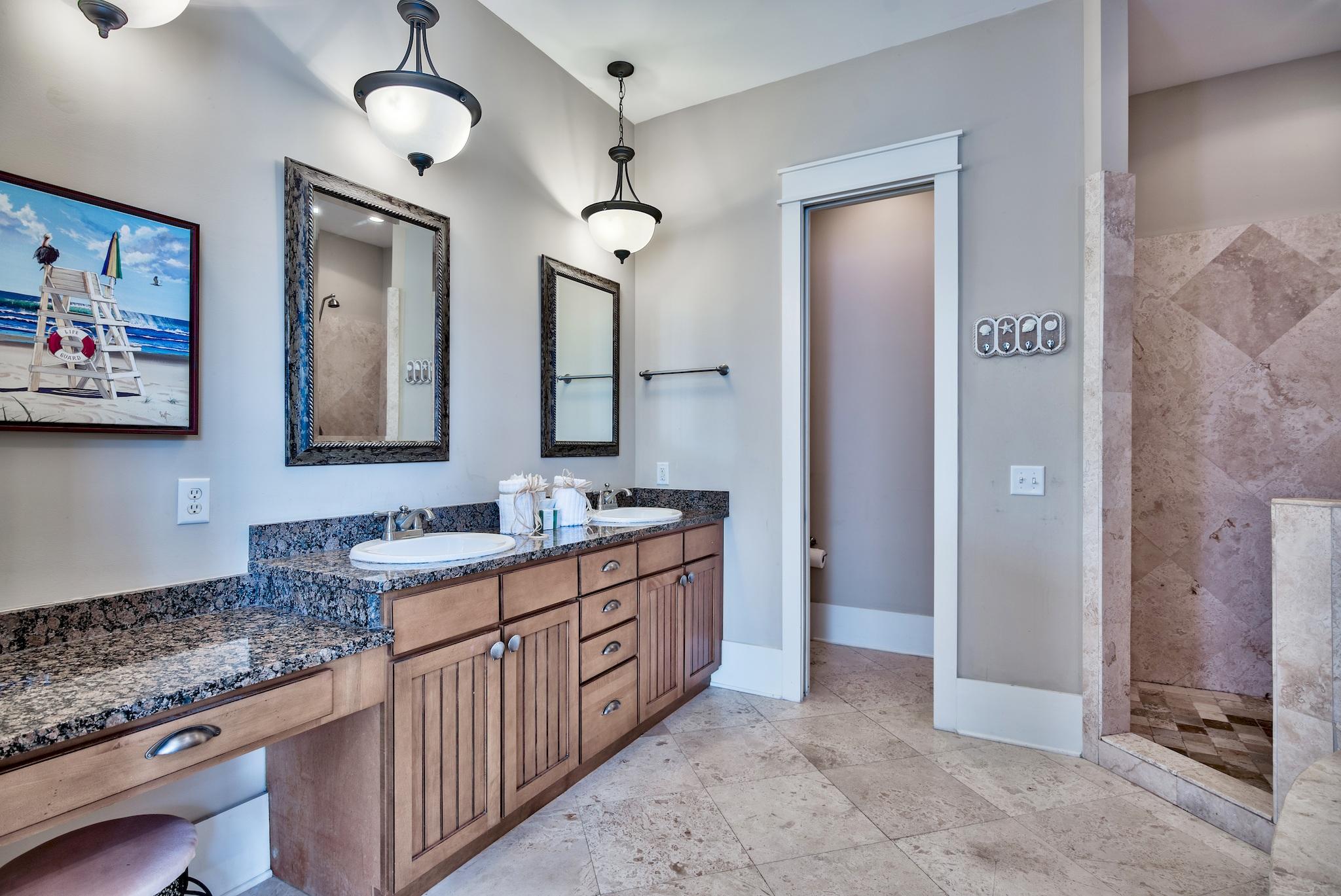 8045 East County Highway 30A Inlet Beach, FL 32461 - Photo 27 of 38 a bathroom with double vanity sink two mirror a window and a shower