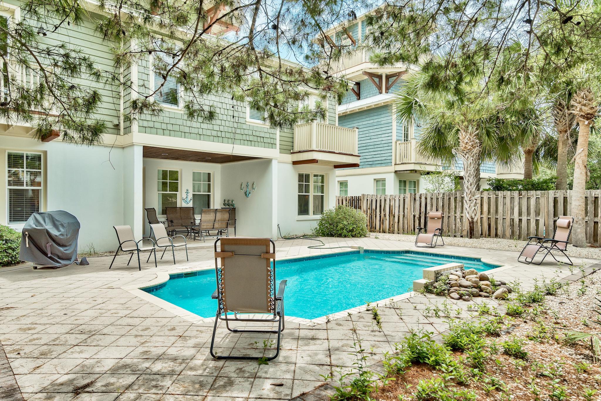 8045 East County Highway 30A Inlet Beach, FL 32461 - Photo 30 of 38 a front view of a house with garden