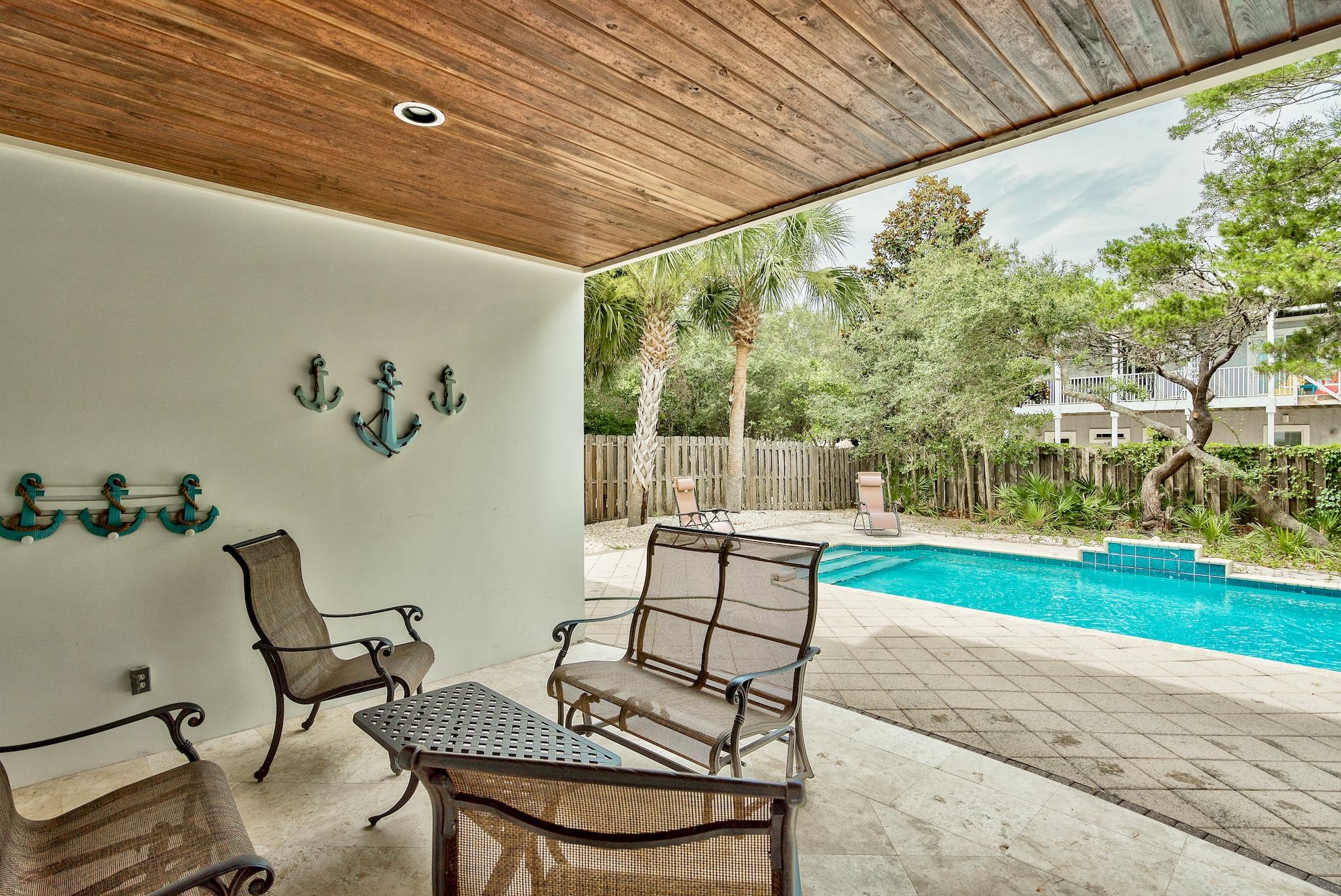 8045 East County Highway 30A Inlet Beach, FL 32461 - Photo 4 of 38 a view of a patio with a table and chairs in patio
