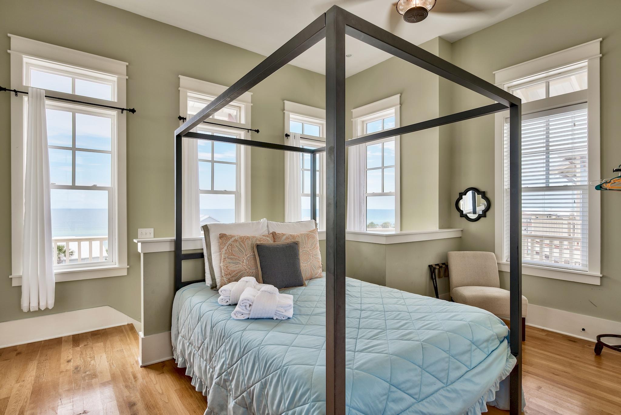 8045 East County Highway 30A Inlet Beach, FL 32461 - Photo 31 of 38 a bedroom with a bed and wooden floor