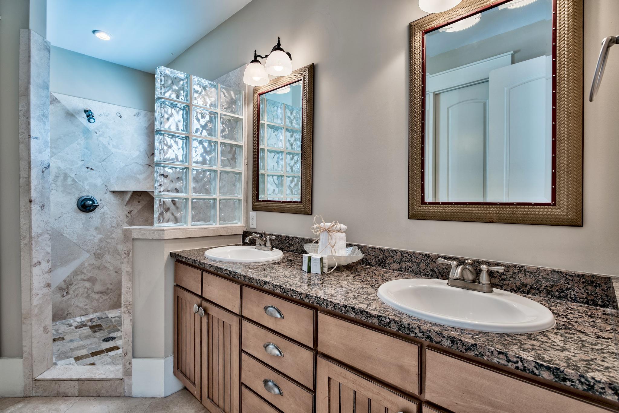 8045 East County Highway 30A Inlet Beach, FL 32461 - Photo 32 of 38 a bathroom with double sink and a mirror